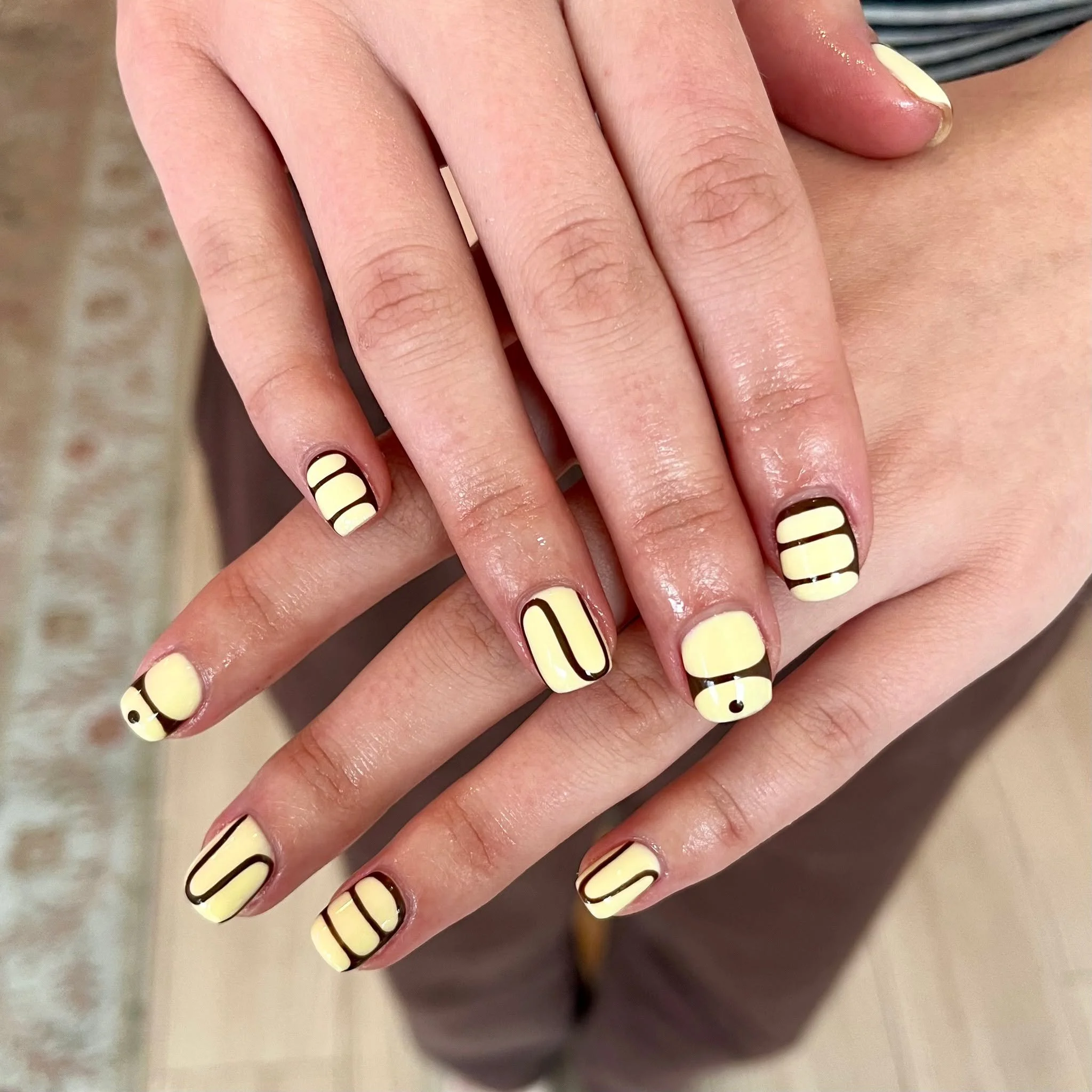 Butter yellow + chocolate swirl 🤎💛 // Tier 3 nail art by @nailsbysophcall 

Polished Hamilton is open Tuesday-Saturday from 10-7pm and Sunday 10-4! Book online @ polishedhamilton.com 

#nailsdesign #nailtechs #nailtech #NailPolish #SalonOpening #na