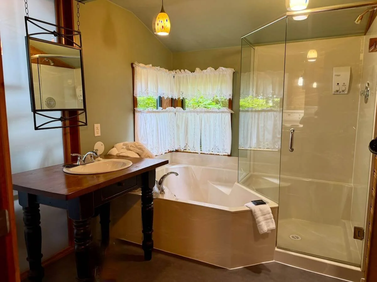View of Cabin 12's vanity, shower and soaker tub