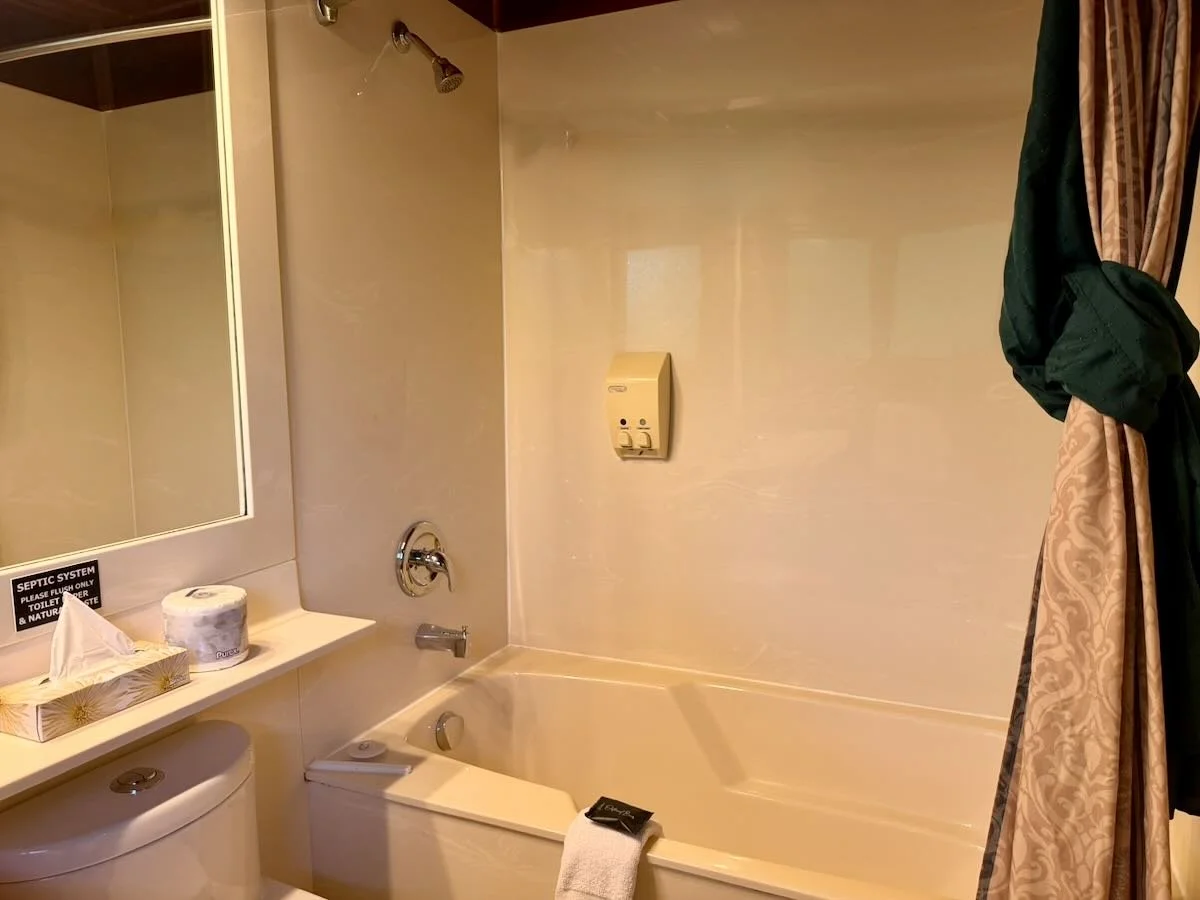 Cabin 10 bathroom, with tub and shower combo.