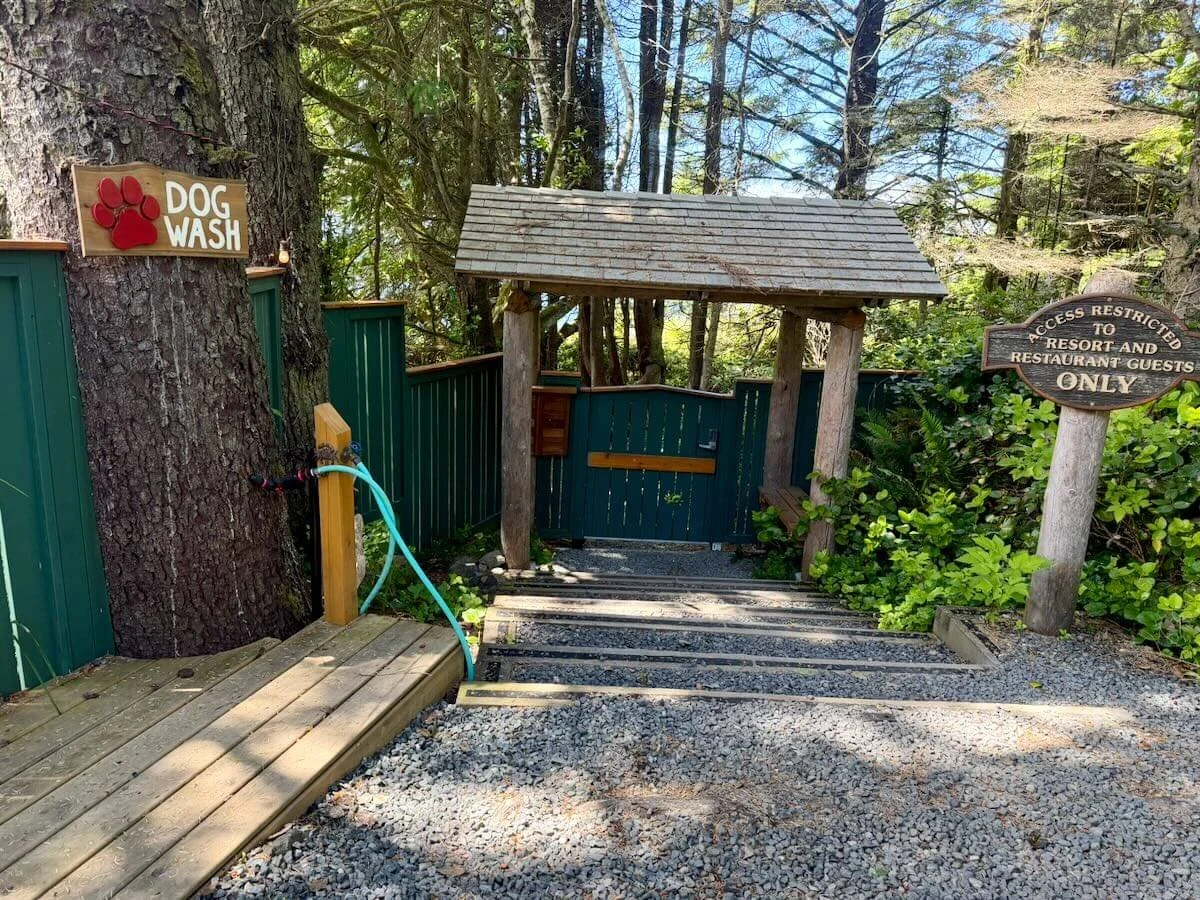View of gate to Point no Point trails and beach access with dog wash station nearby.