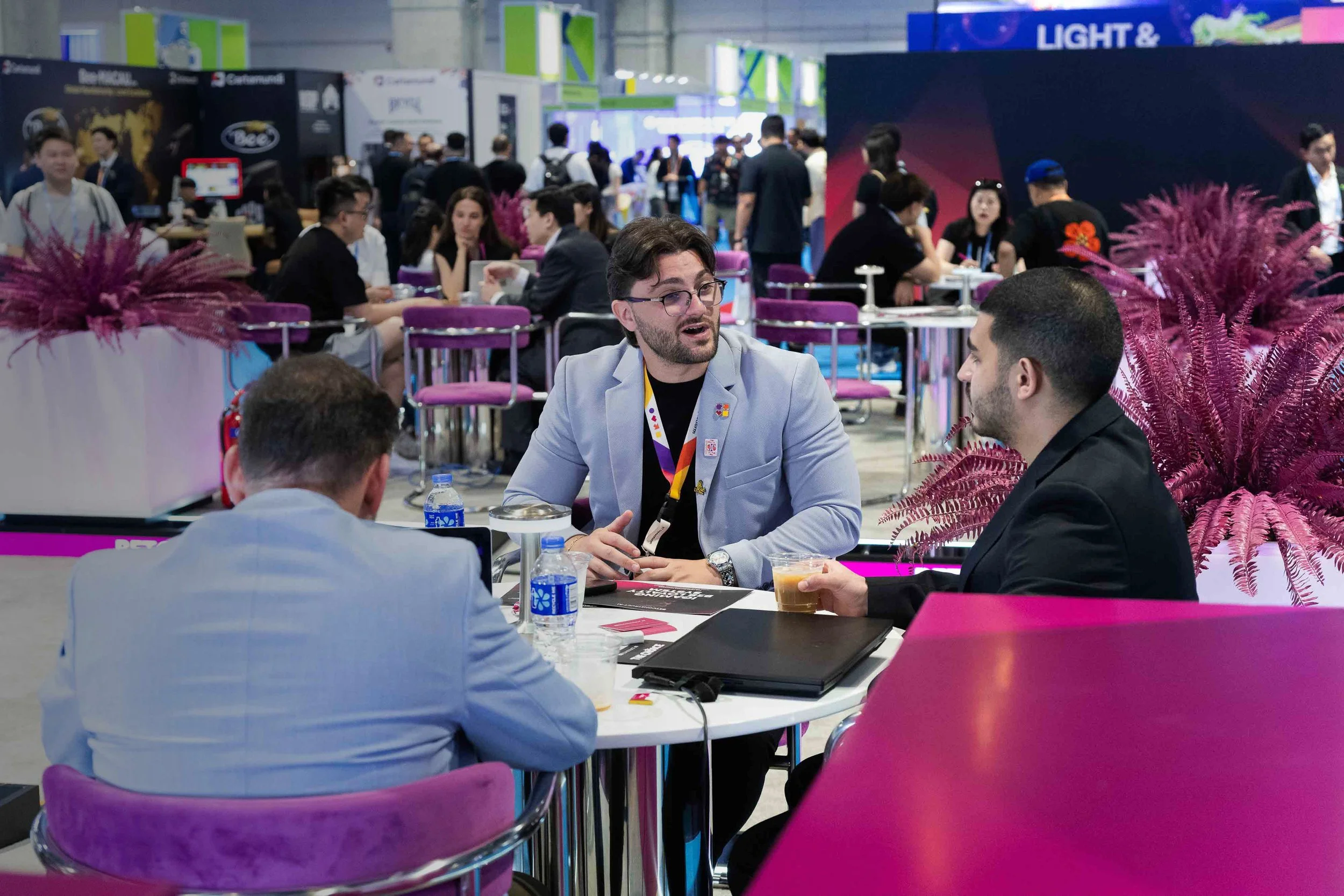 Exhibitor and conference coverage in Macau, capturing trade show booths, speaker sessions, networking and business event moments.