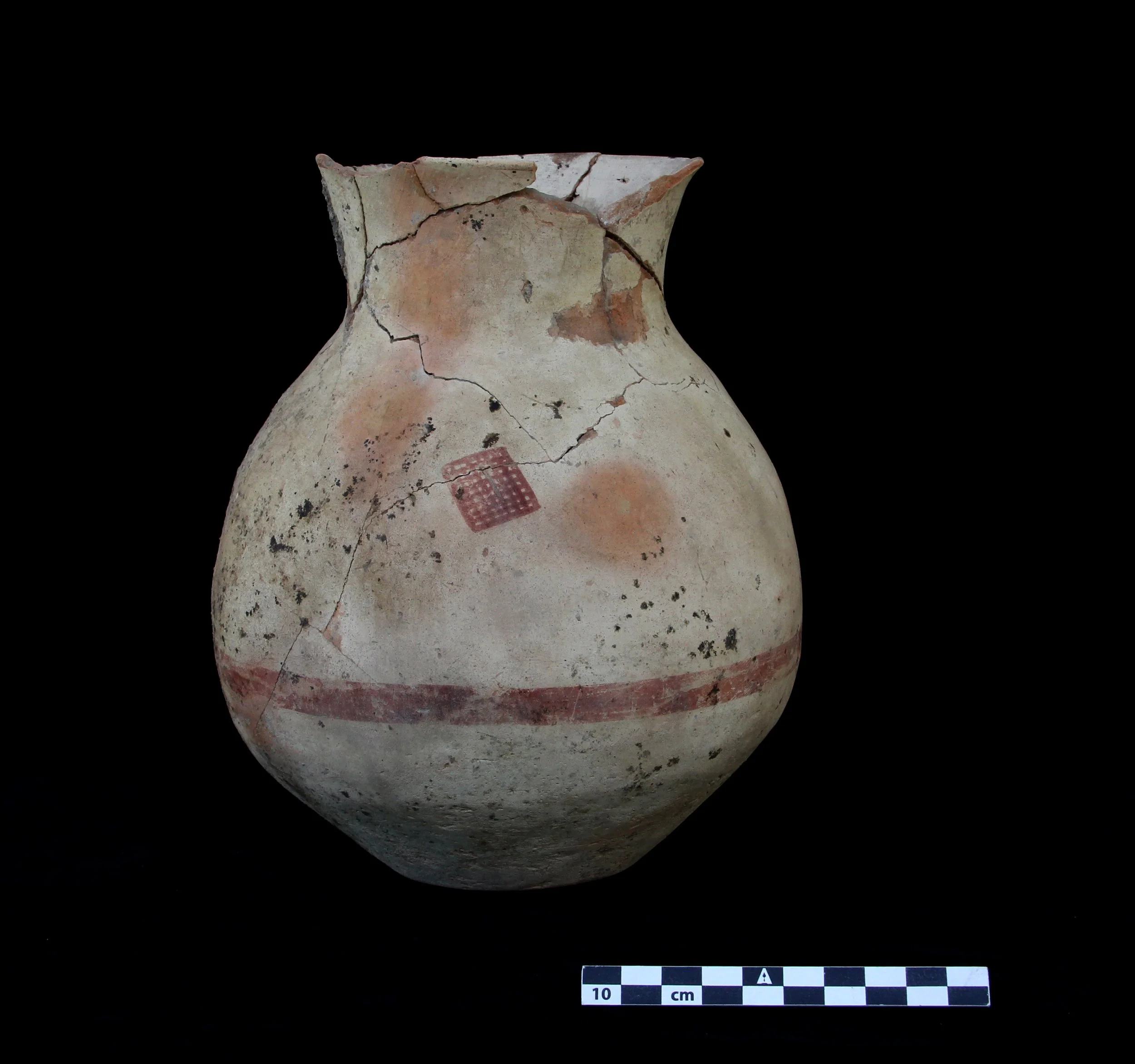 Painted ceramic jar, photographed on black velvet