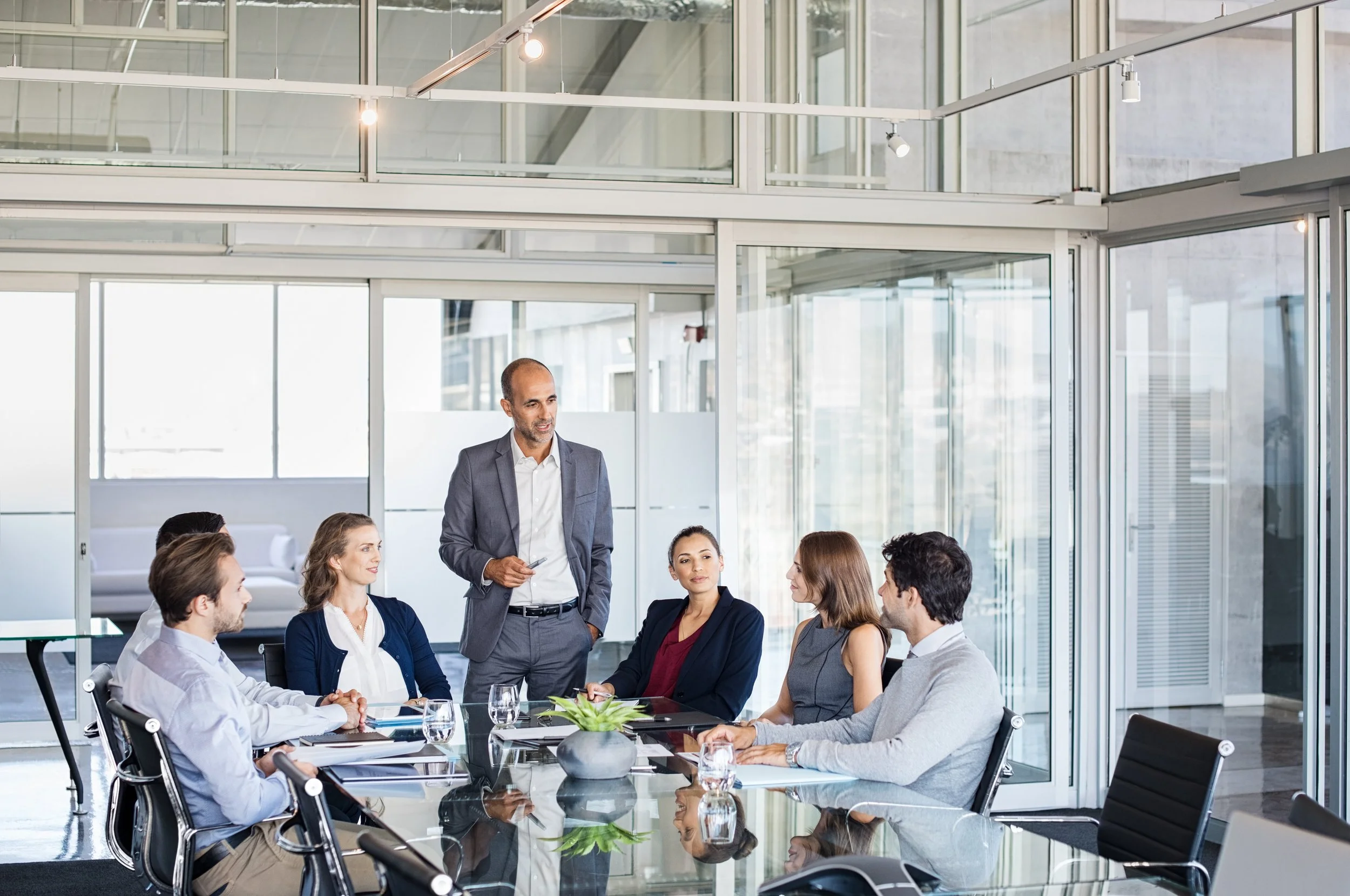 Picture of a team meeting in a modern conference room.