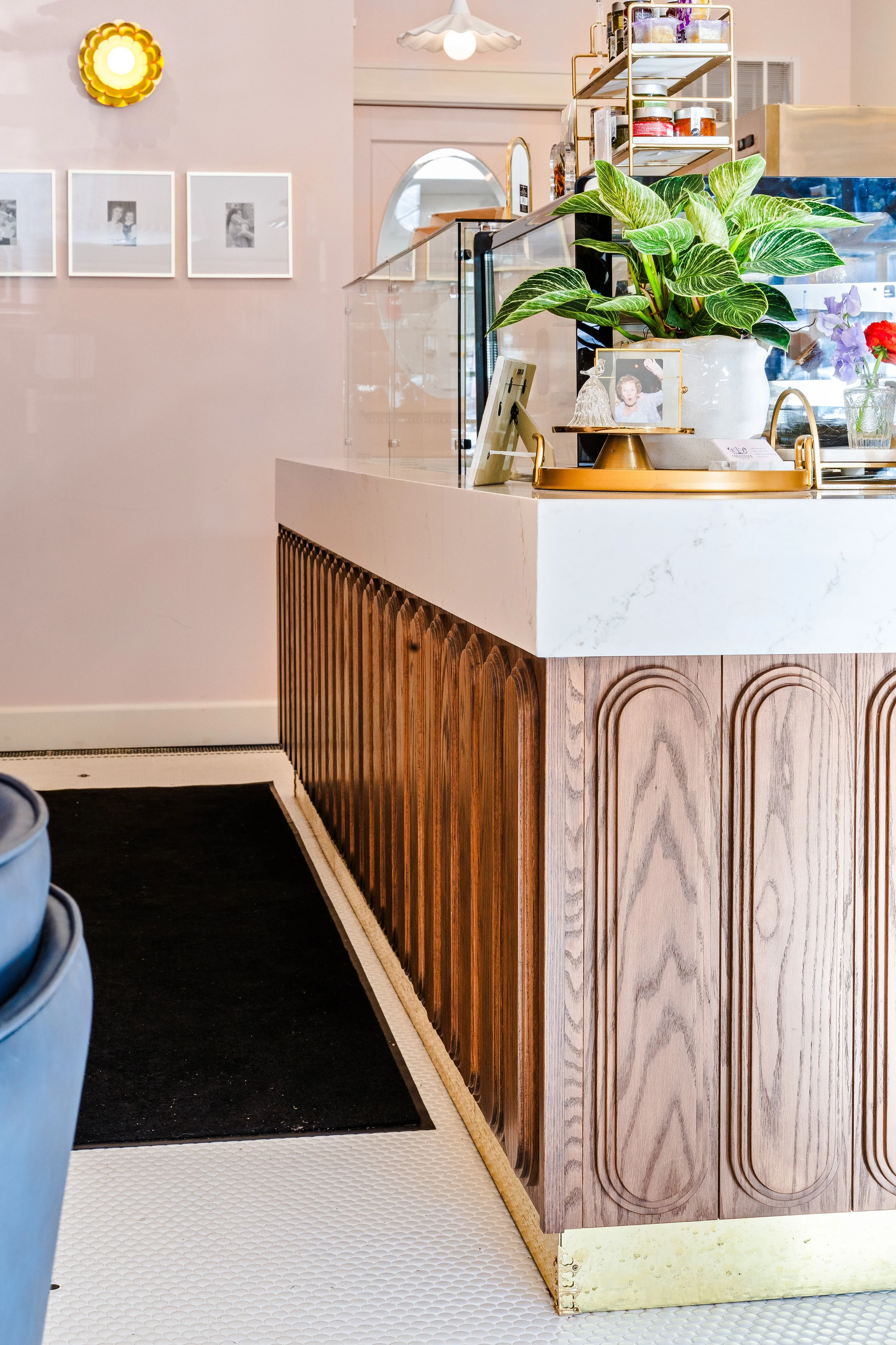 Close-up of waterfall countertop edge and custom cabinetry.