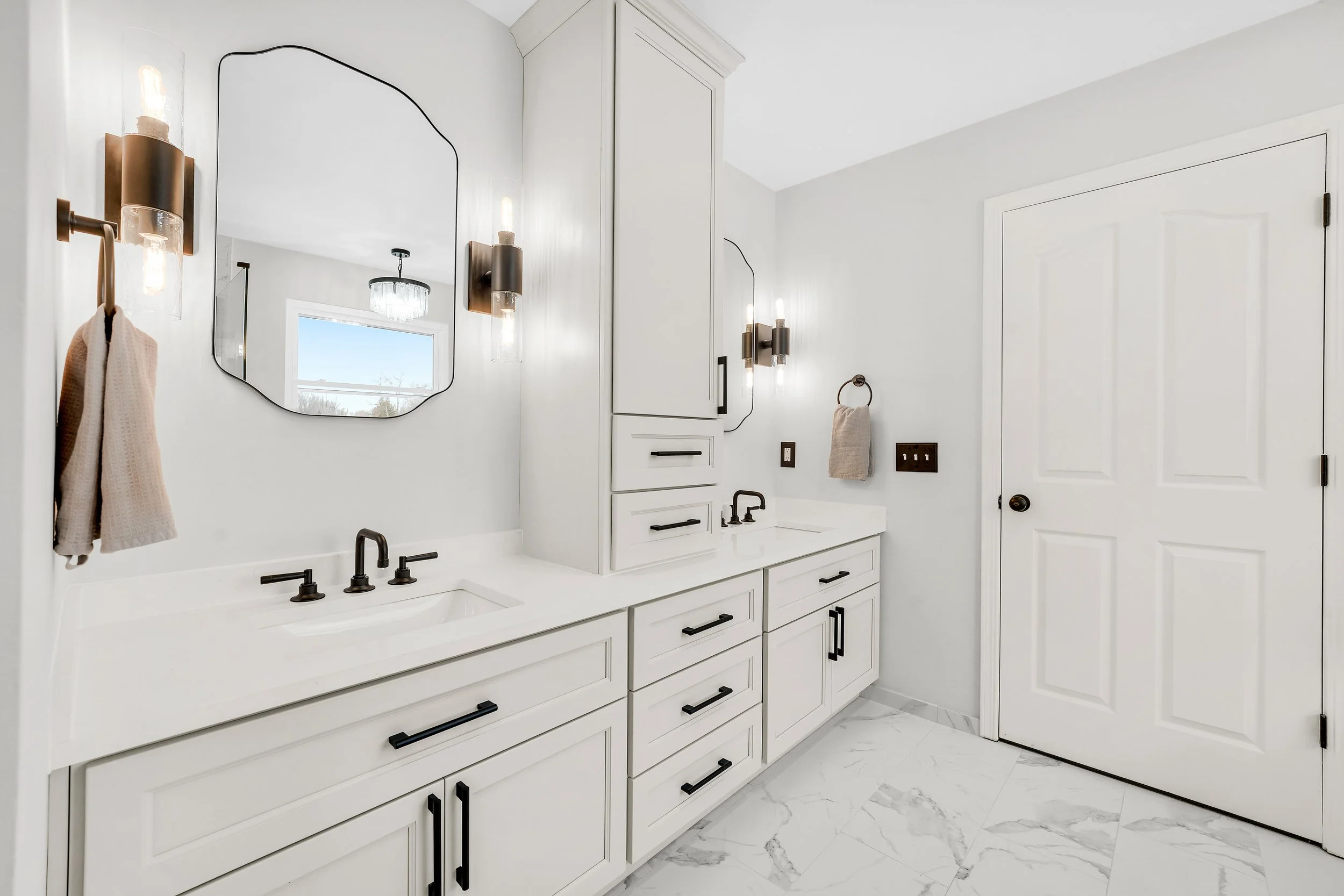 Gray double vanity with storage tower