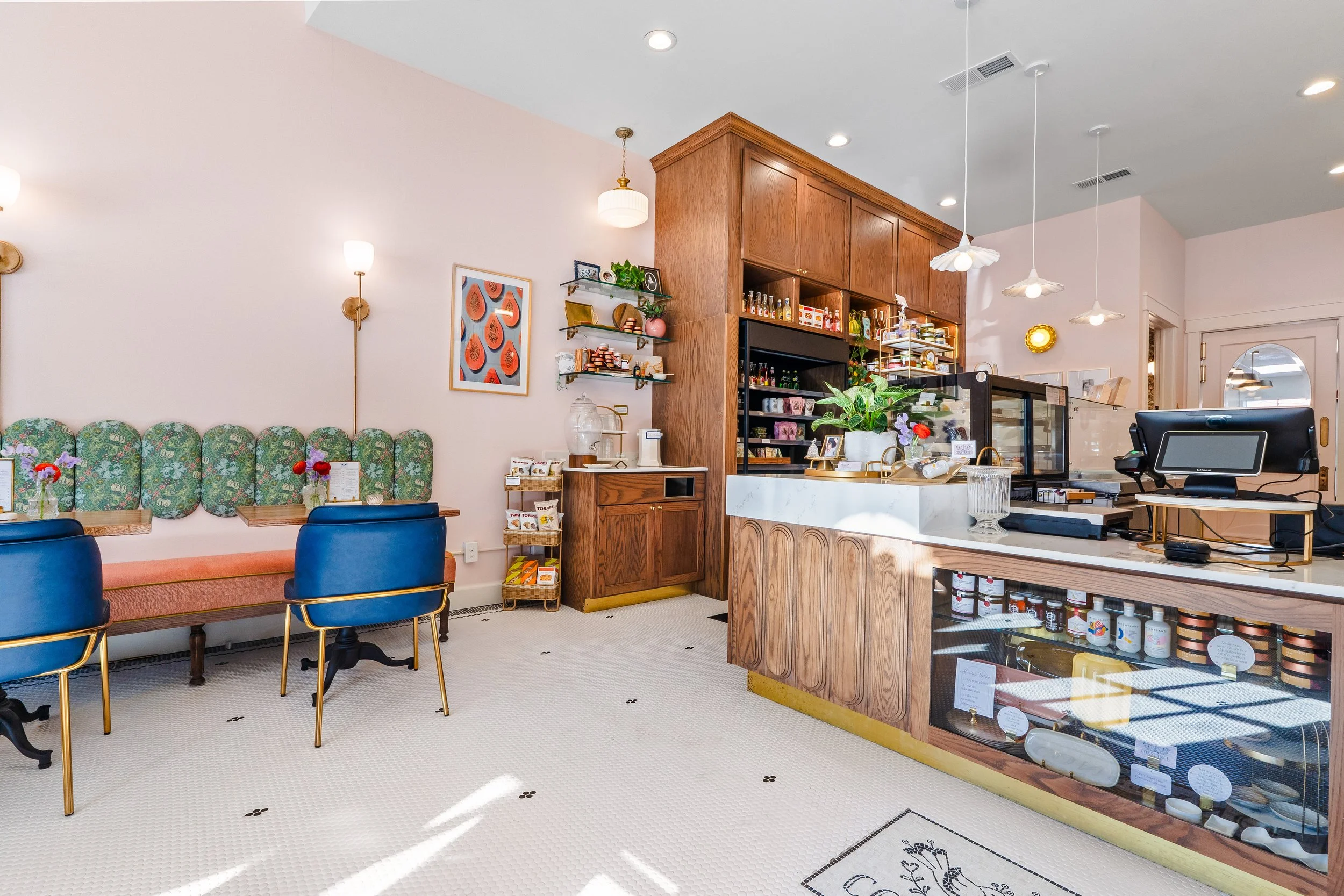 Post renovation photo of Constance Fromagerie and Cafe looking towards counter and cafe seating.