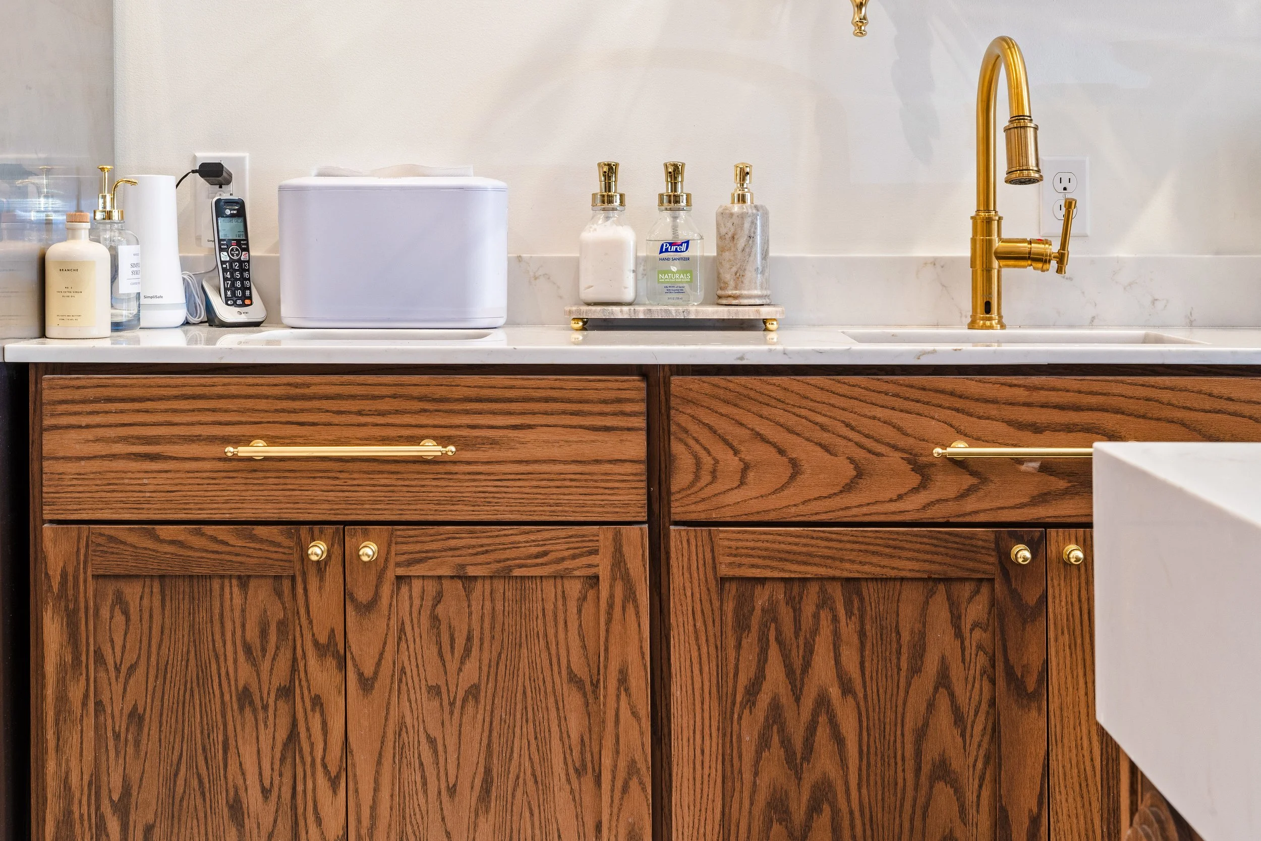 Custom cabinetry and brass cabinet pulls.