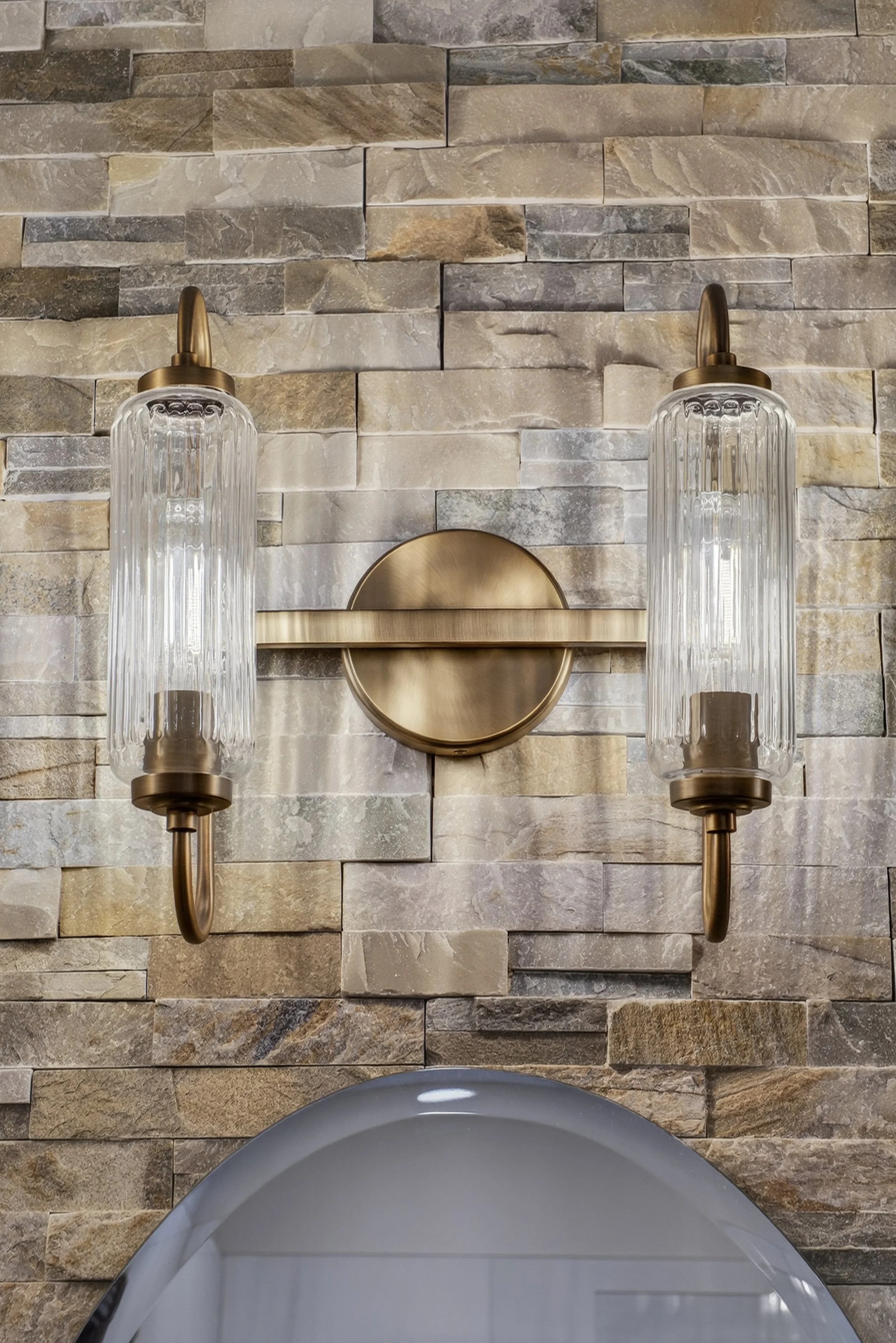 Fluted glass vanity lights.
