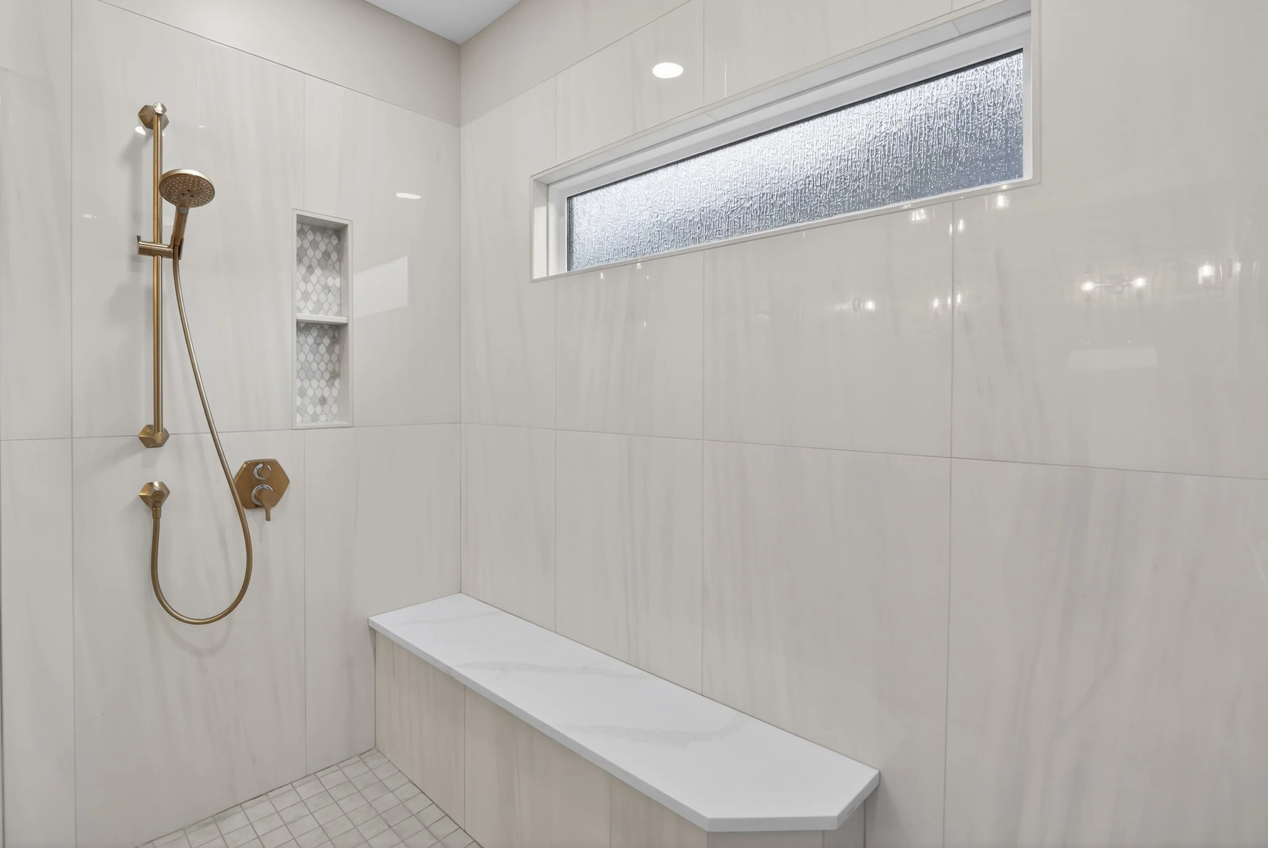 Corner bench in shower.
