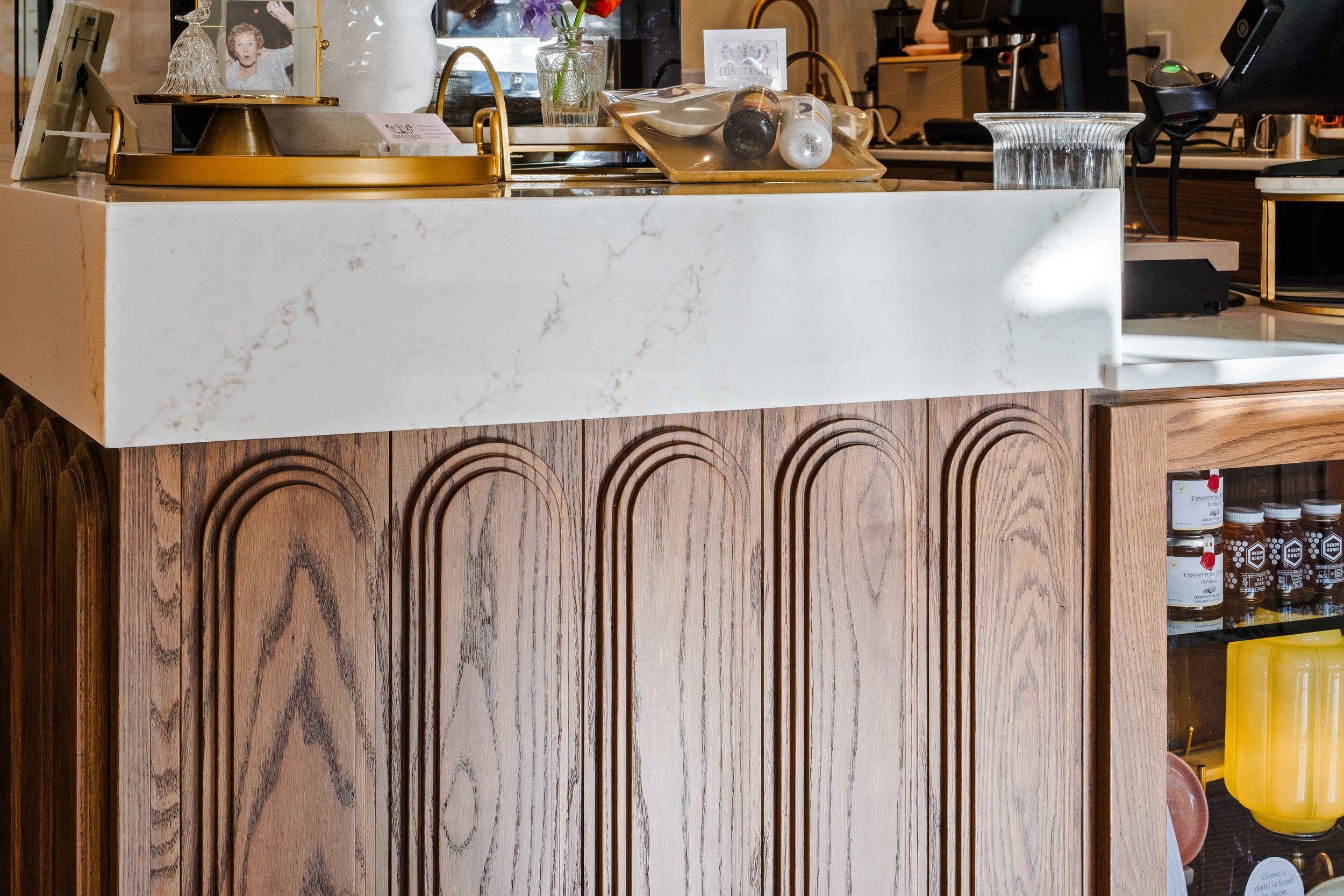 Close-up of waterfall countertop edge and custom cabinetry.