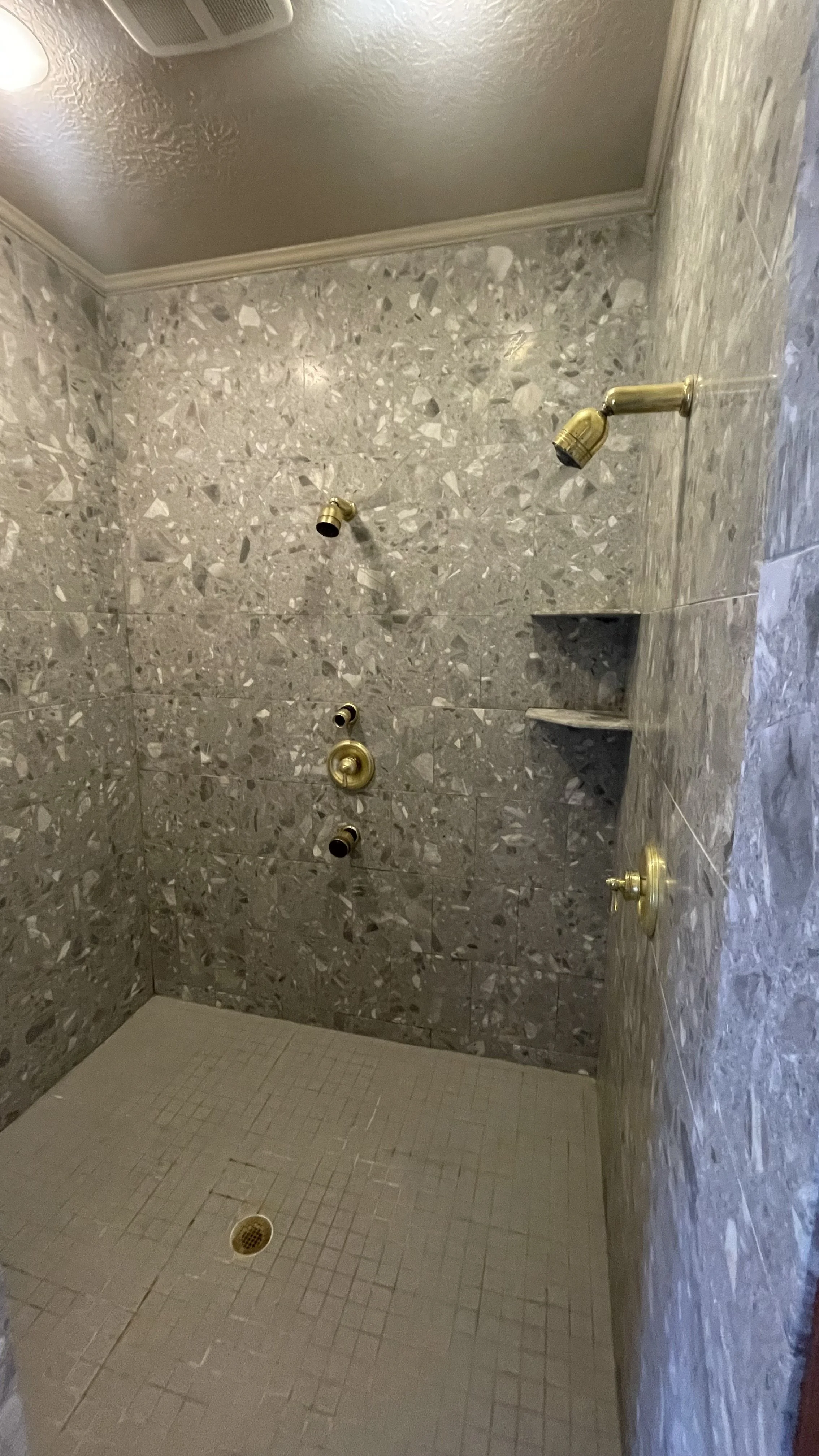 Walk in shower that leaked before replacement.