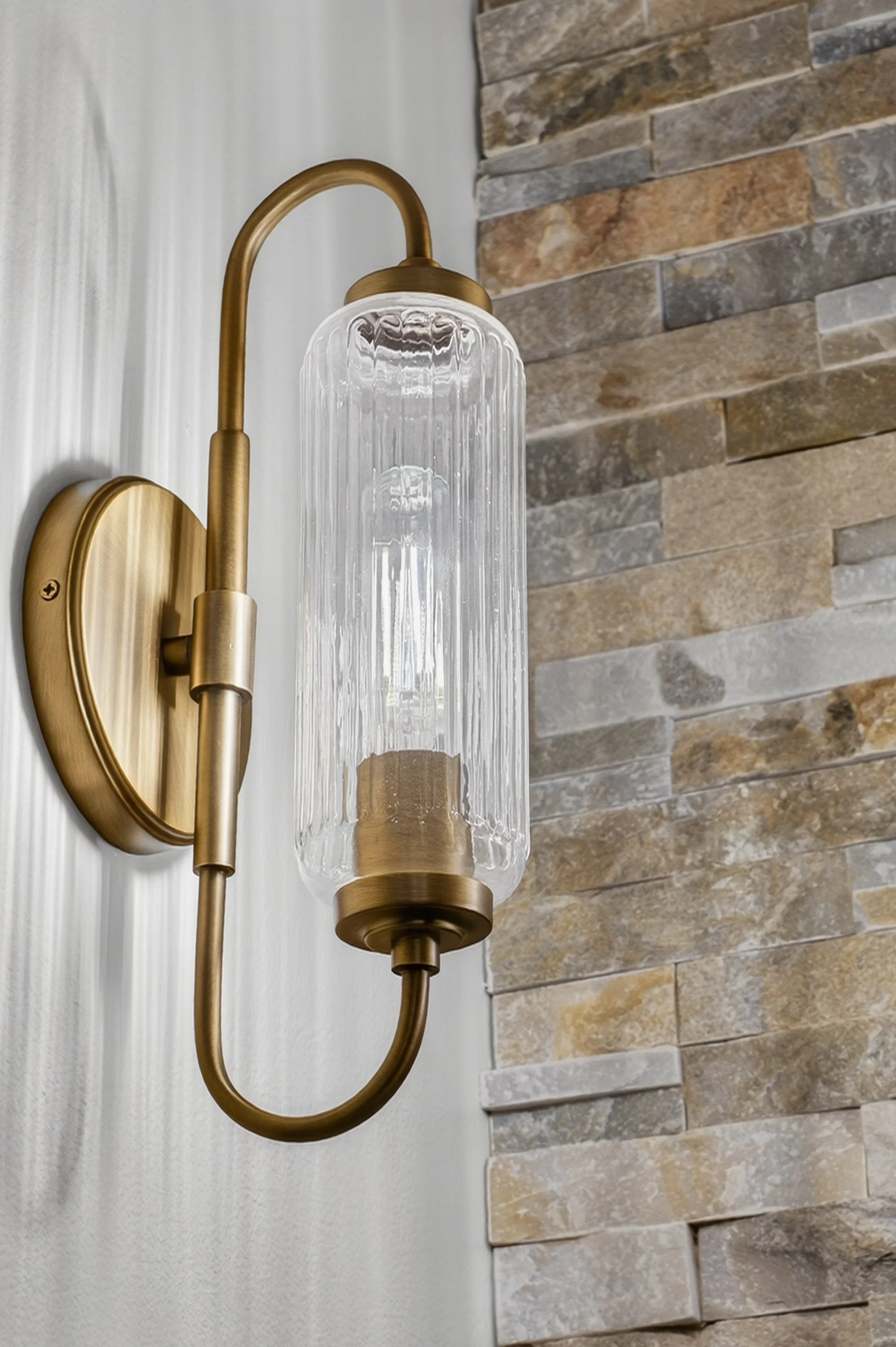 Fluted glass vanity light.