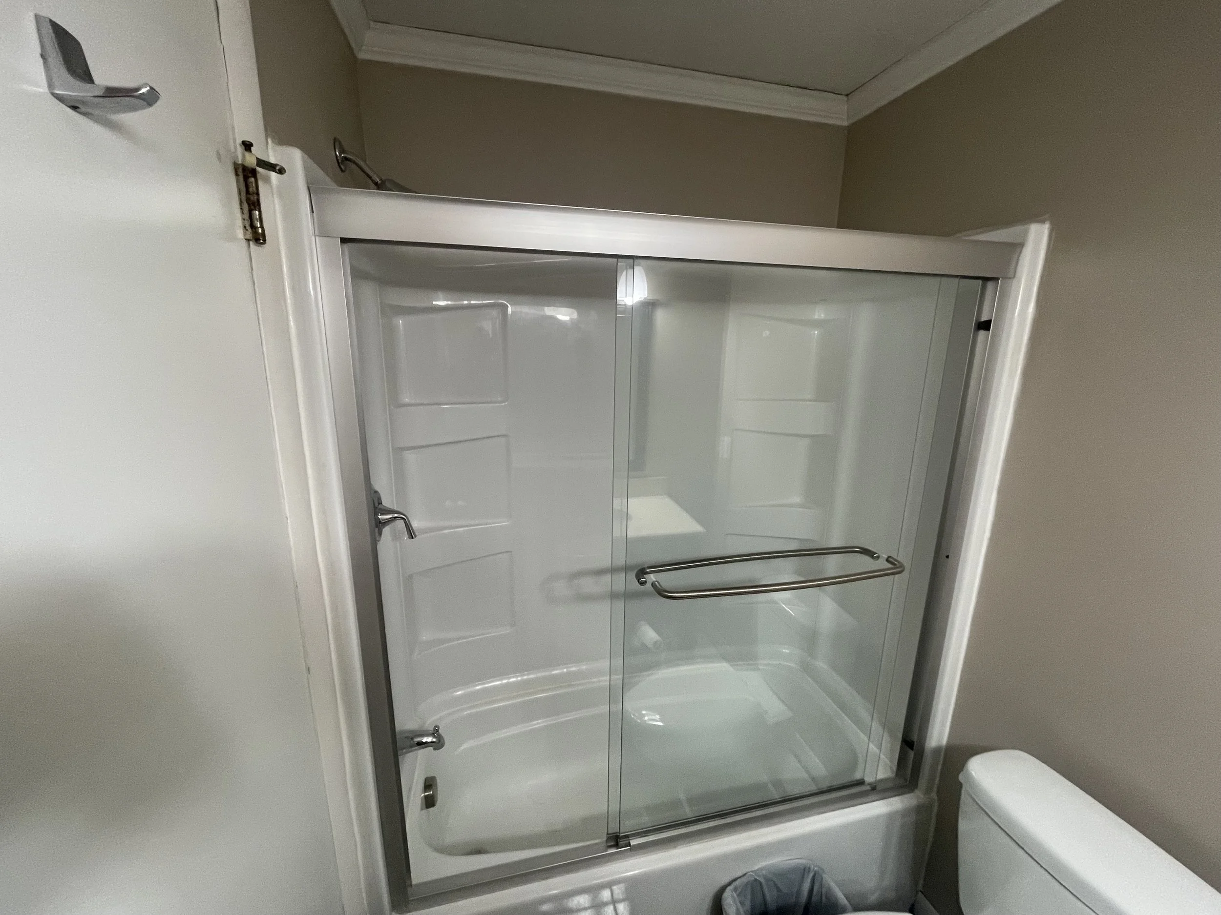 Old bathtub with glass door