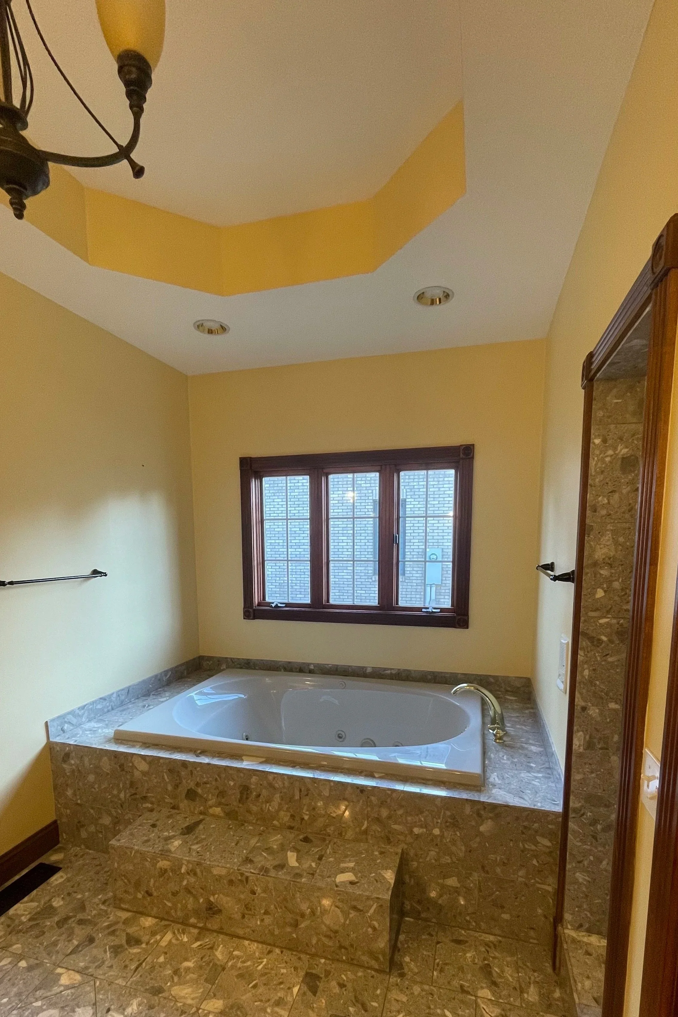 Drop in tub in large master bathroom.