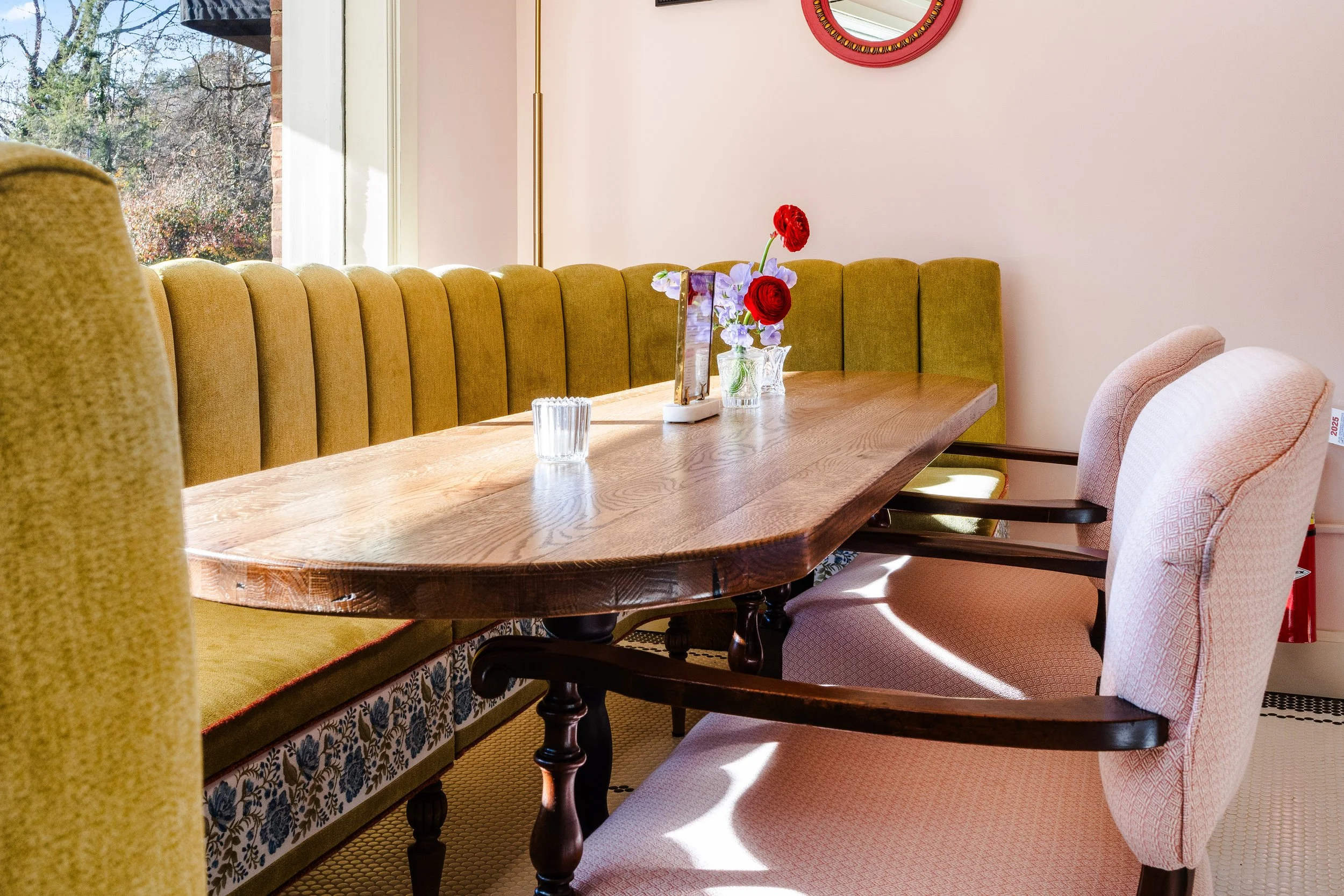 Cafe eating area with custom upholstered bench seating.