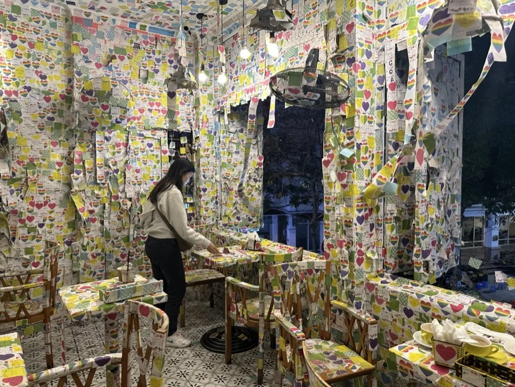 Note Café covered in layers of cute notes from travelers around the world-I could spend hours just reading