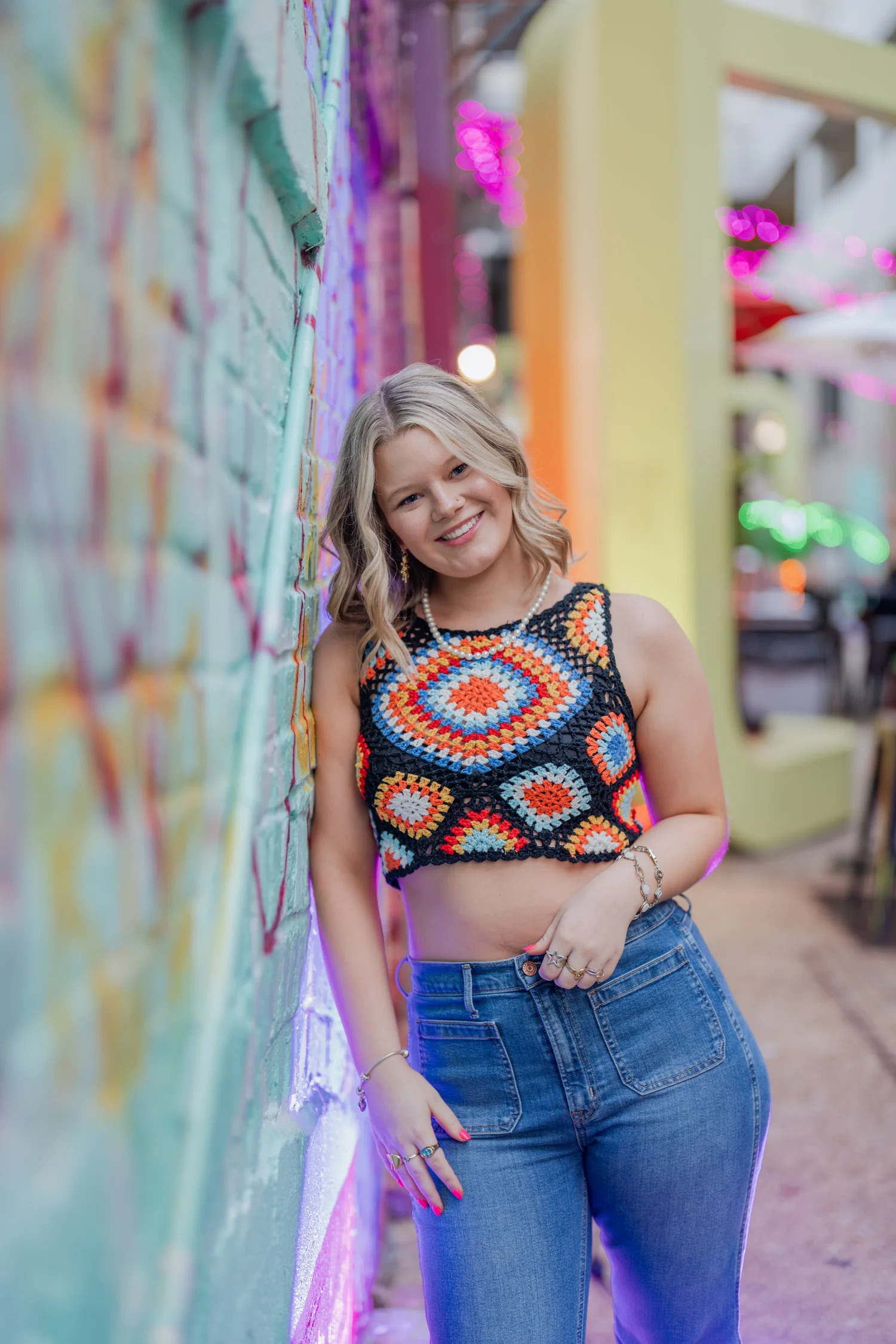 Colorful outdoor portrait near a mural