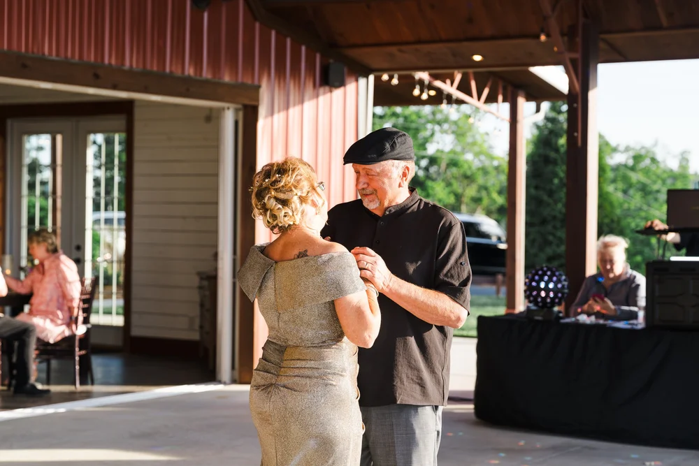 Couple dancing during a wedding celebration photographed by Luther Studios