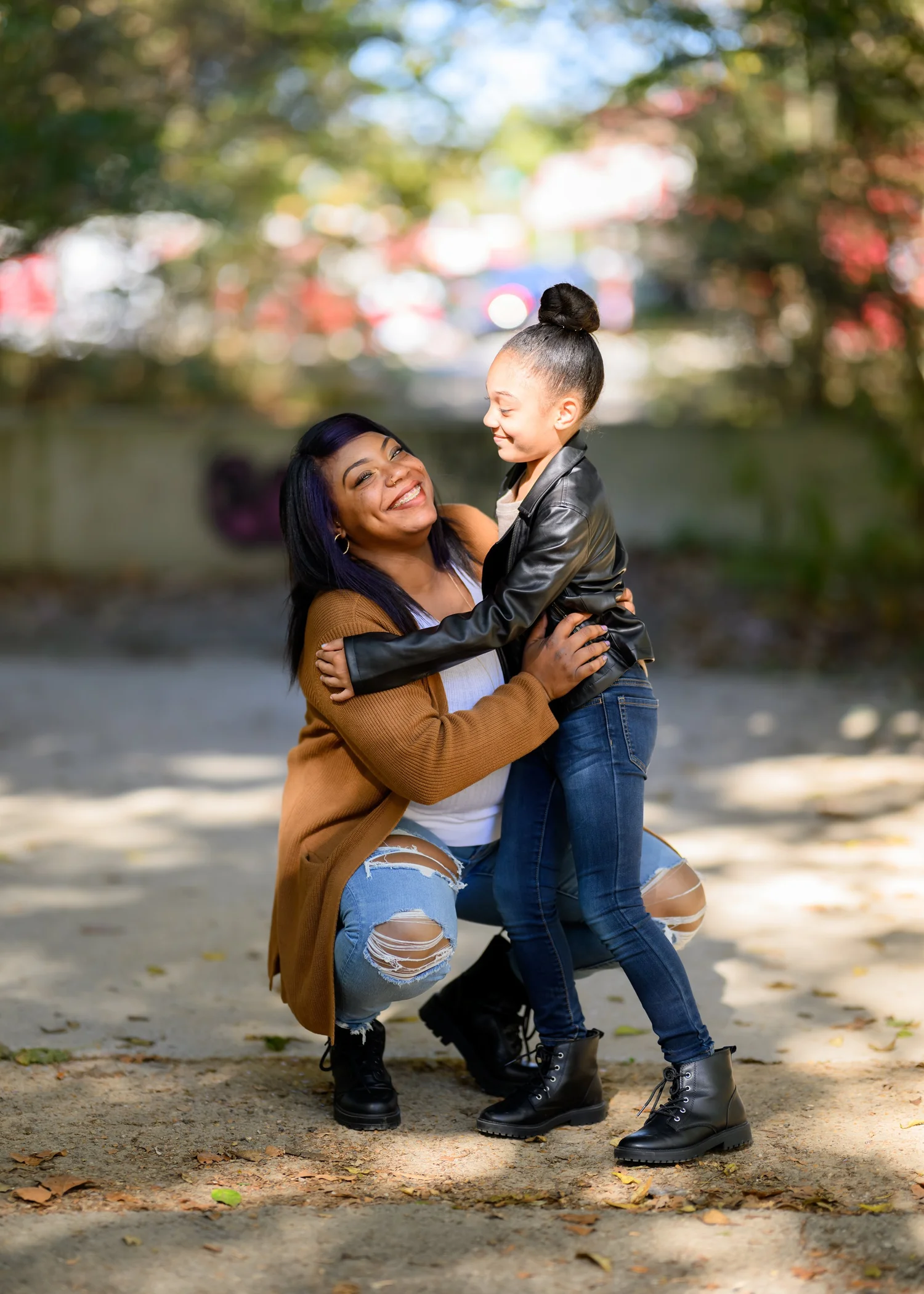 Mother holding her daughter during an outdoor session