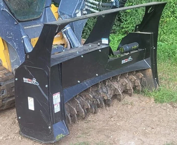 Industrial forestry mulcher clearing brush and trees for land clearing in Springfield, Missouri by T&D Land Management