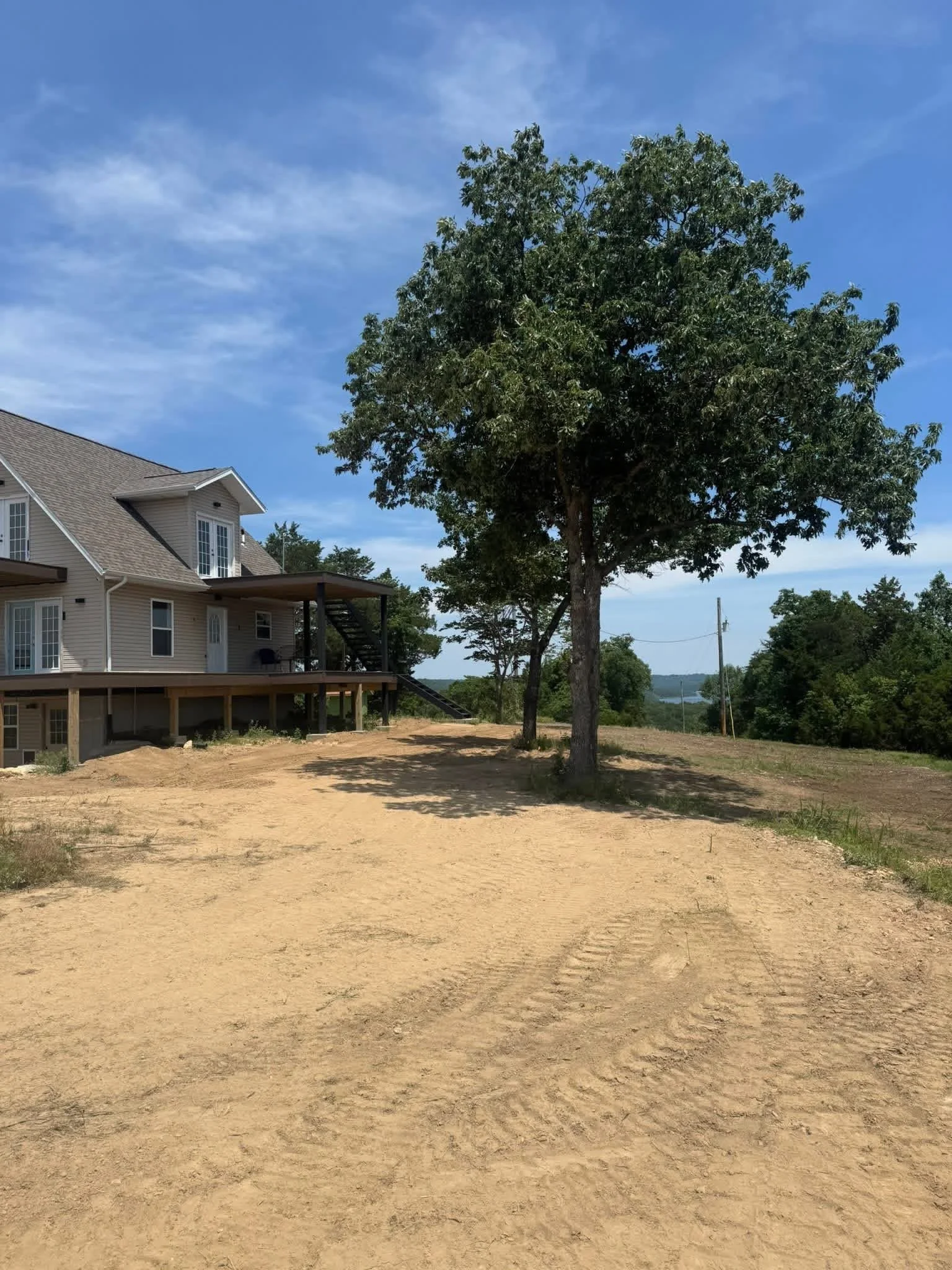 Finish grading and leveling project at a residential property in Shell Knob, MO completed by T and D Land Management.