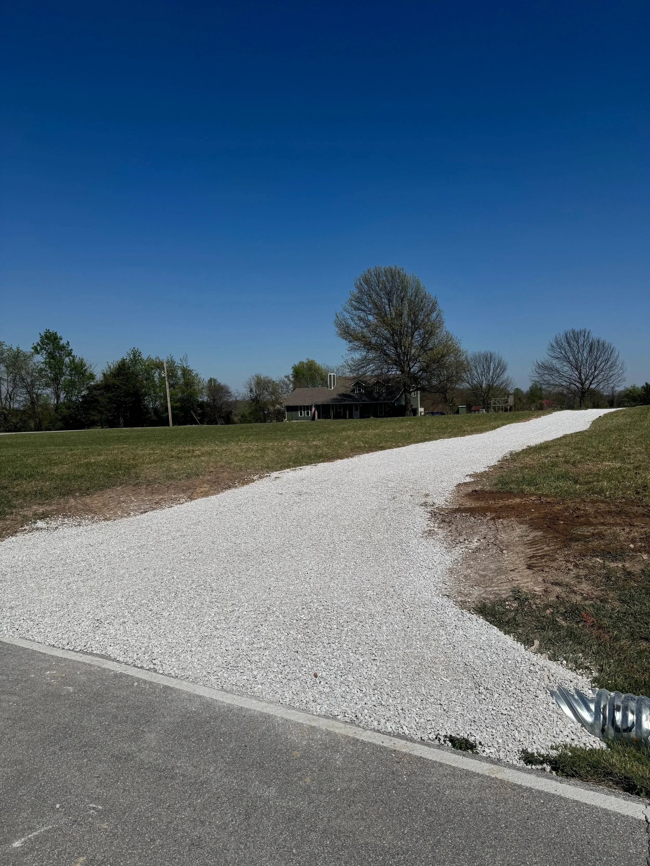 New driveway excavation and gravel installation in Willard, Missouri with professional grading and site preparation for long-lasting property access.