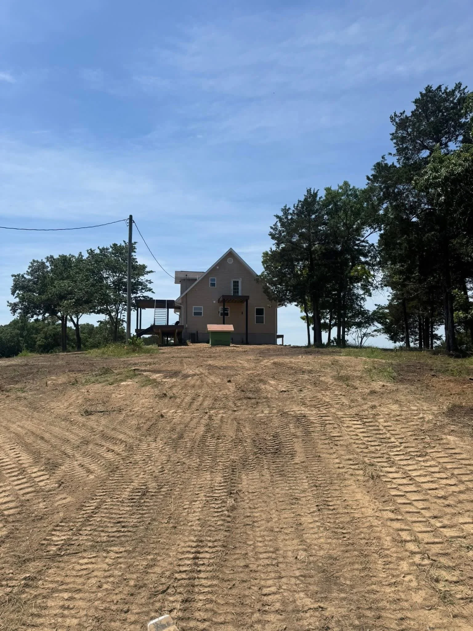Residential property after grading and leveling services in Shell Knob, Missouri by T and D Land Management.
