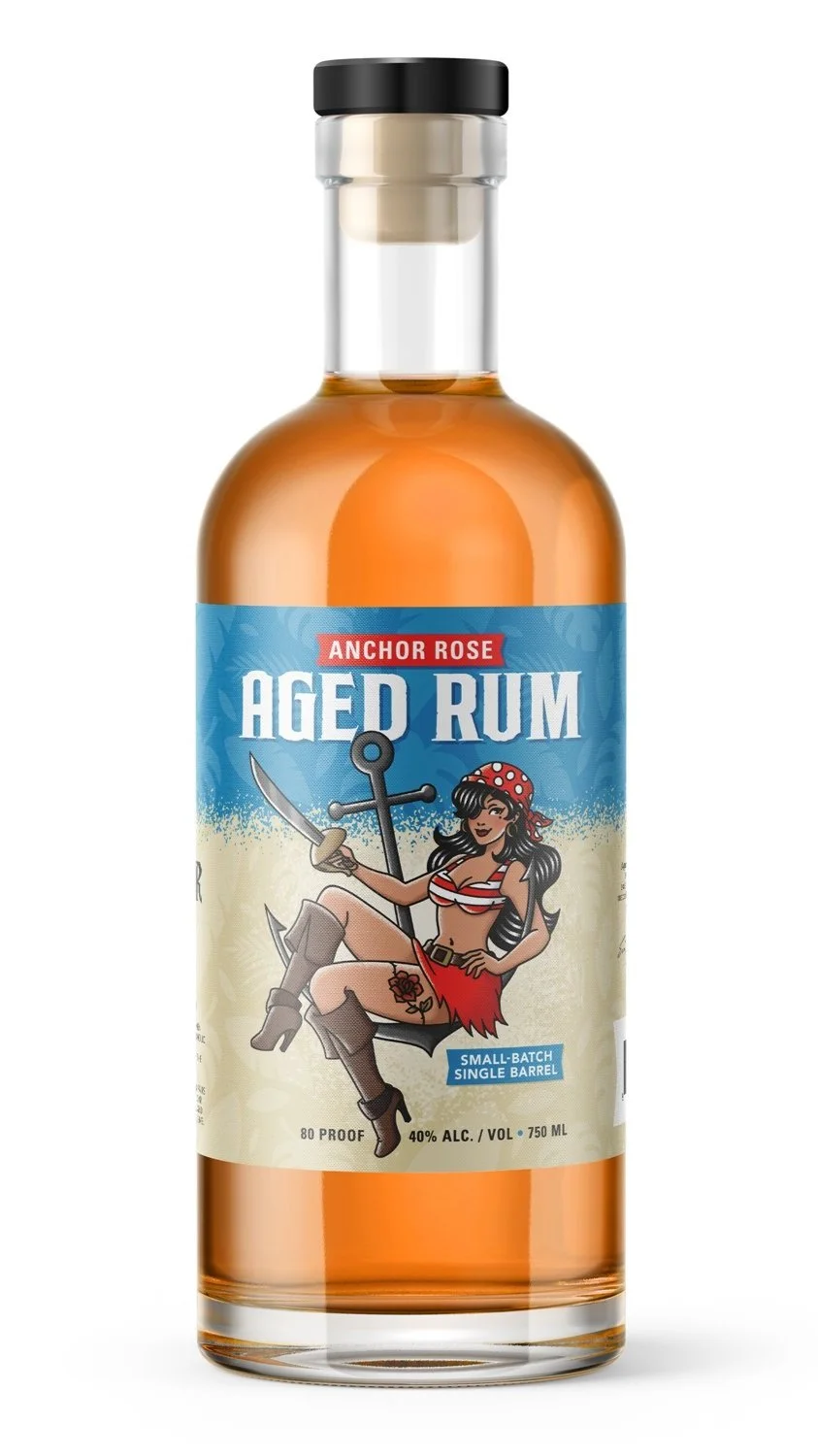 A bottle of Anchor Rose aged rum with a pin-up girl in a red and white striped bikini top, red skirt, and pirate hat on the label.