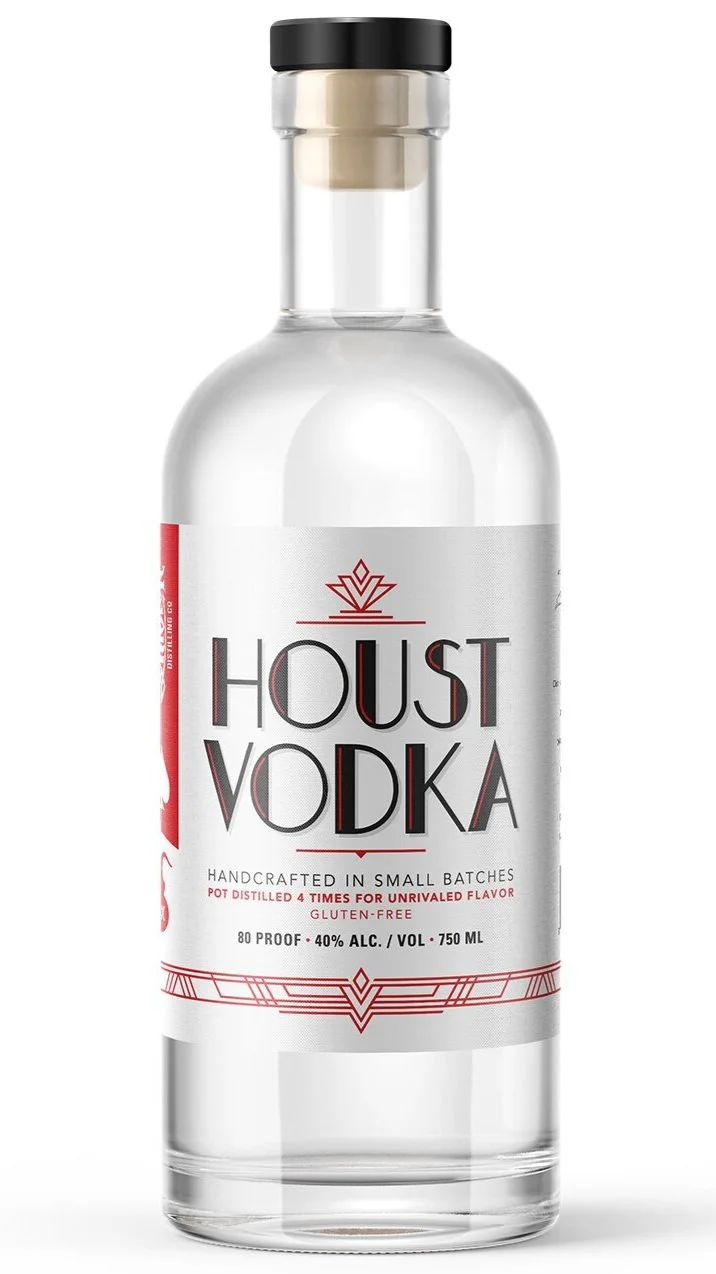 A clear bottle of Houst Vodka with a black cap and a white and red label indicating it is handcrafted, gluten-free, and 750 milliliters in volume, with 40% alcohol content.