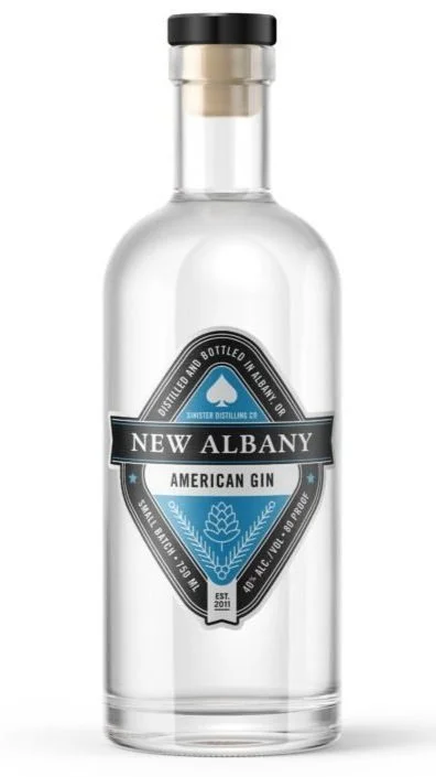 A clear glass bottle of New Albany American Gin with a black cap and a blue and black label.
