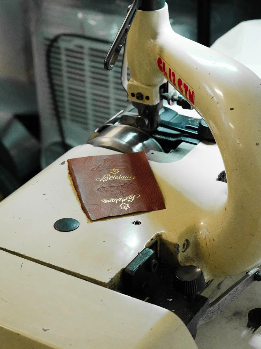 Debossed treatment on leather in workshop.