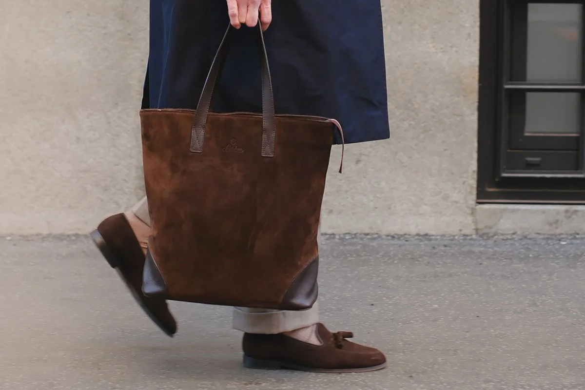 Suzan from Outfit Narrative holding Sartolane Brown Suede Tote