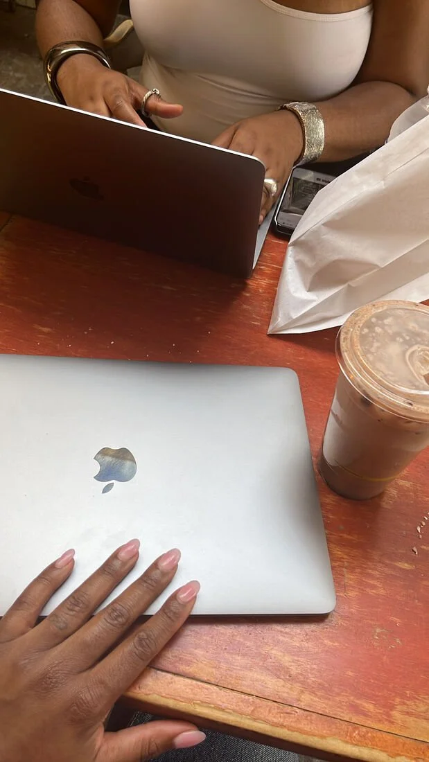 women working on laptops
