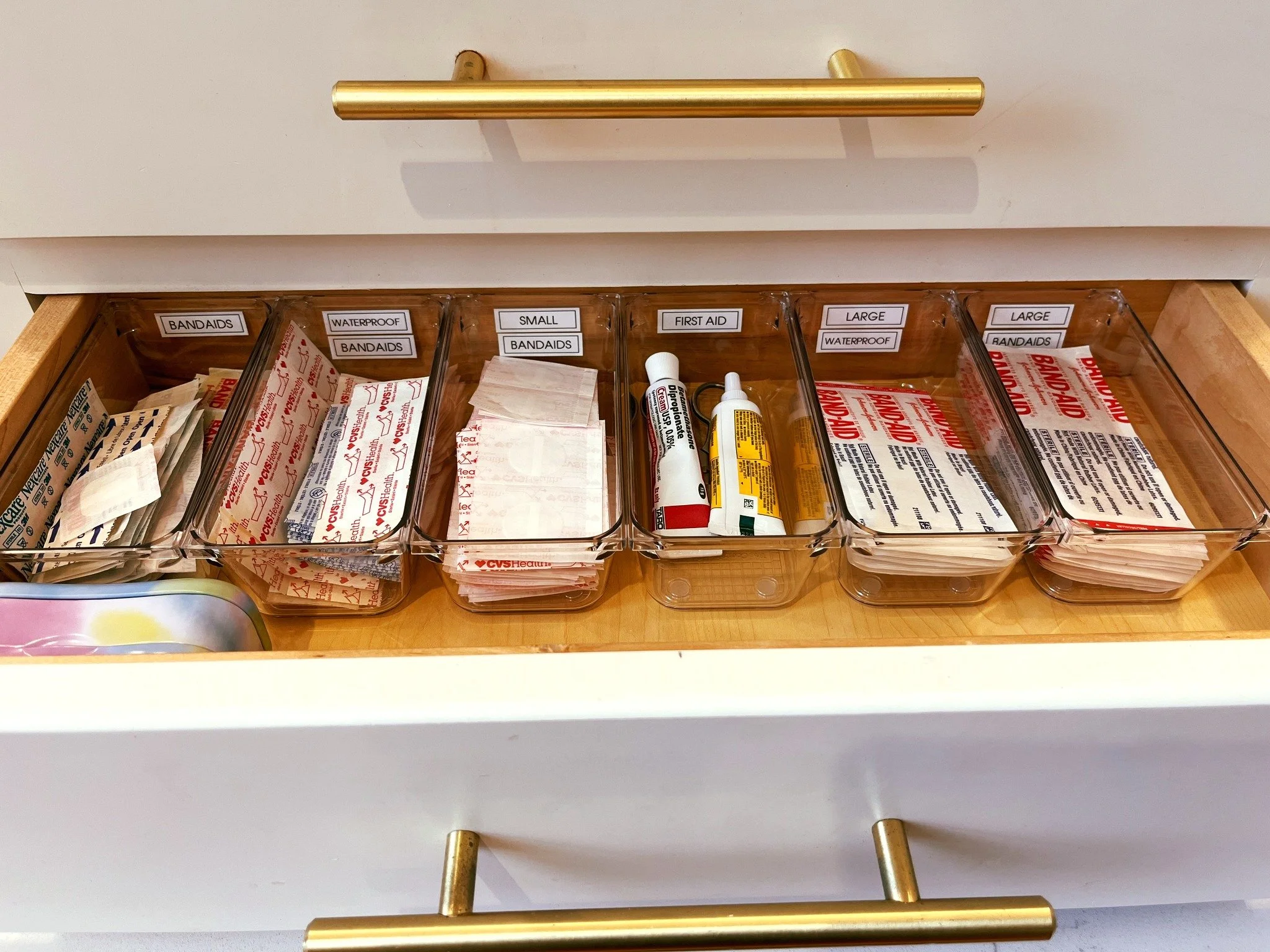 How cute is this First Aid drawer we created for a kids bathroom? These drawers were quite shallow, but worked perfectly for a quick grab-and-go band-aid solution! What do you think?