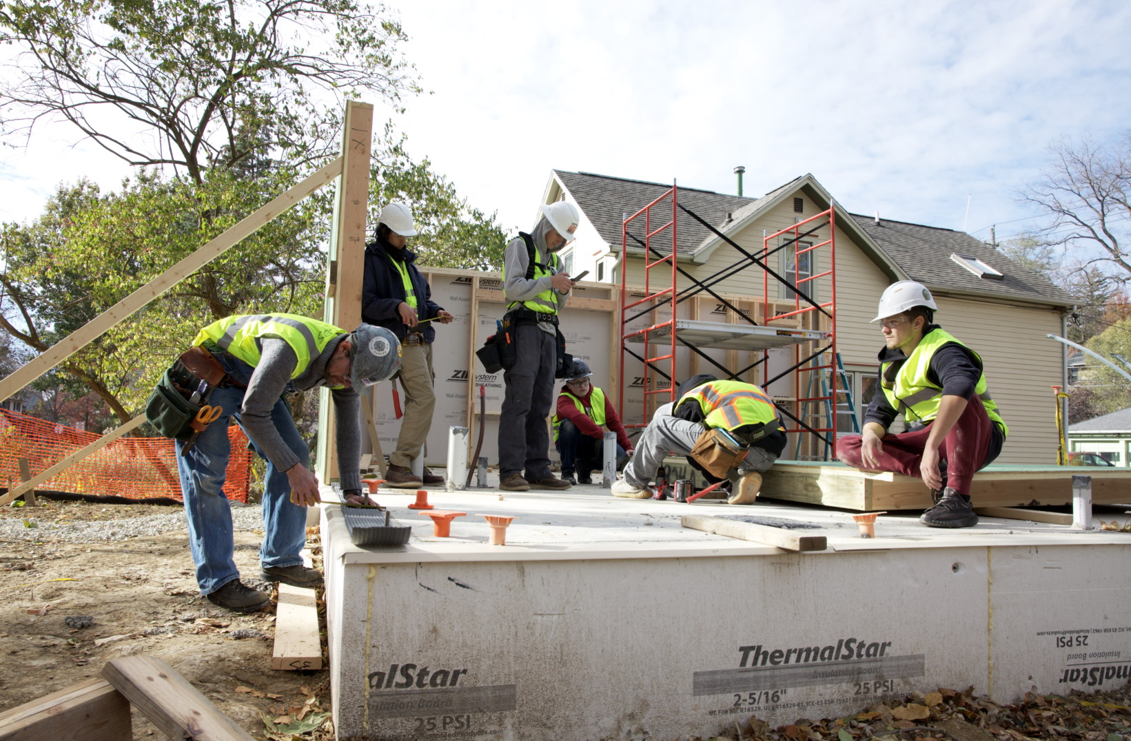 Group shot - working on a wall.png