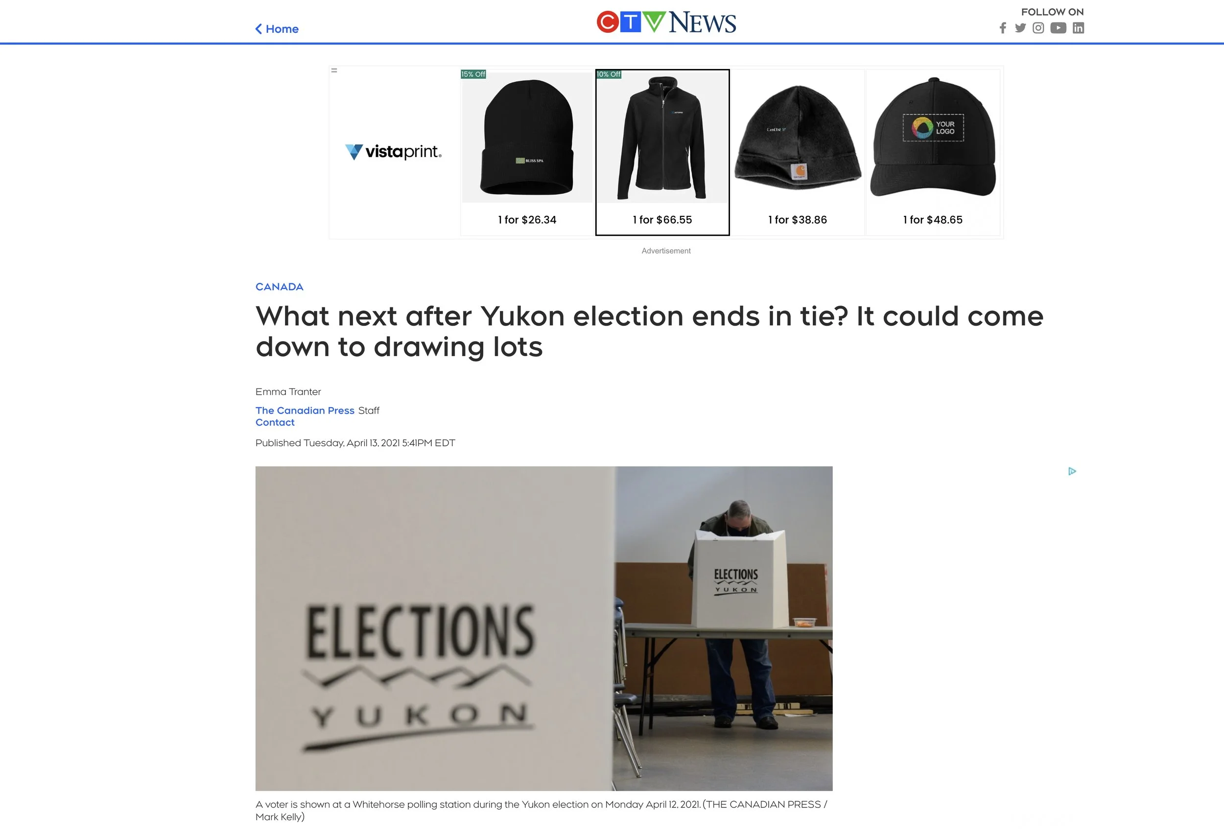 Article on Yukon election tie with voter at polling station
