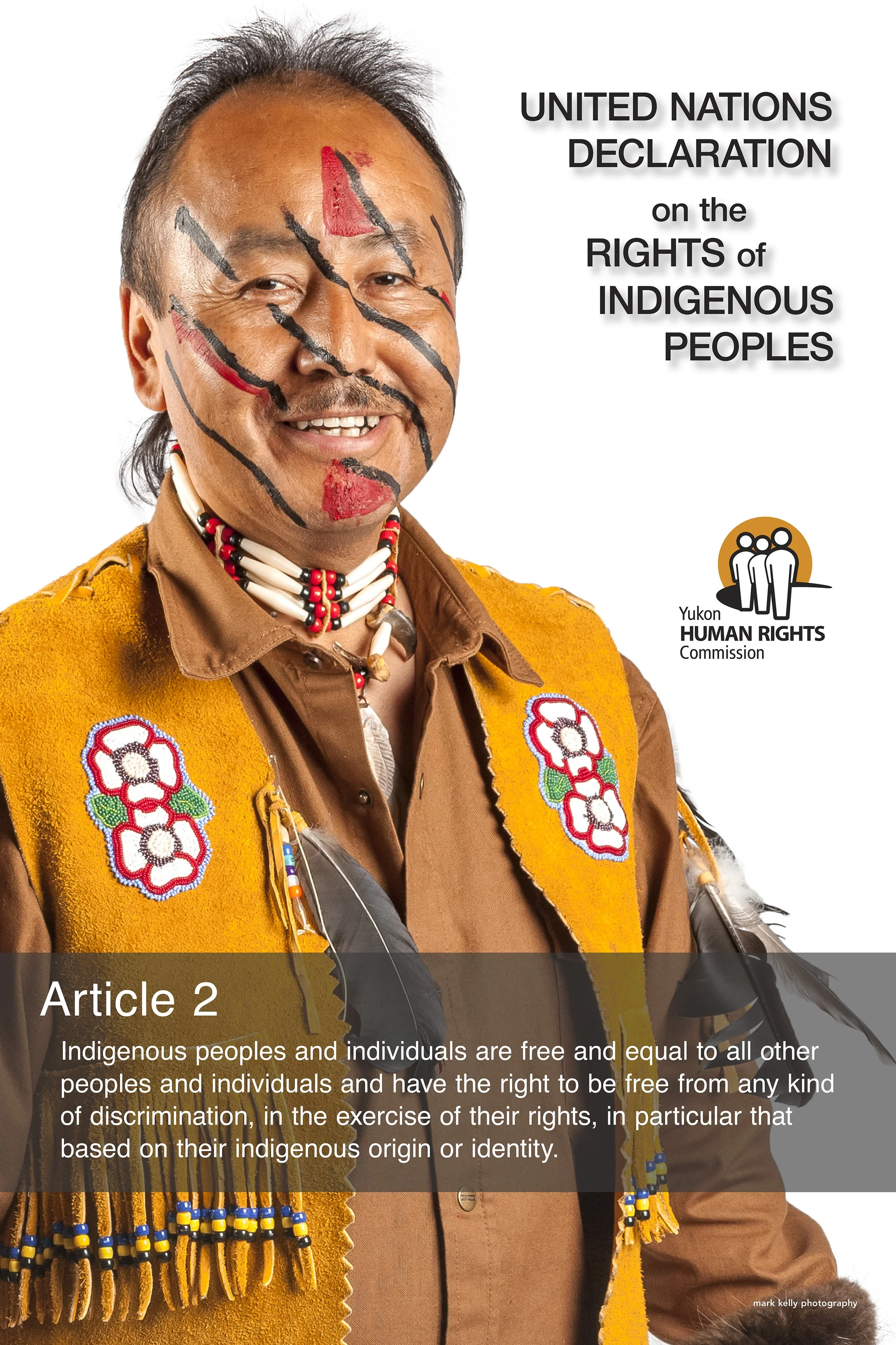 Indigenous man with face paint and traditional clothing promoting the United Nations Declaration on the Rights of Indigenous Peoples, Article 2, by Yukon Human Rights Commission.