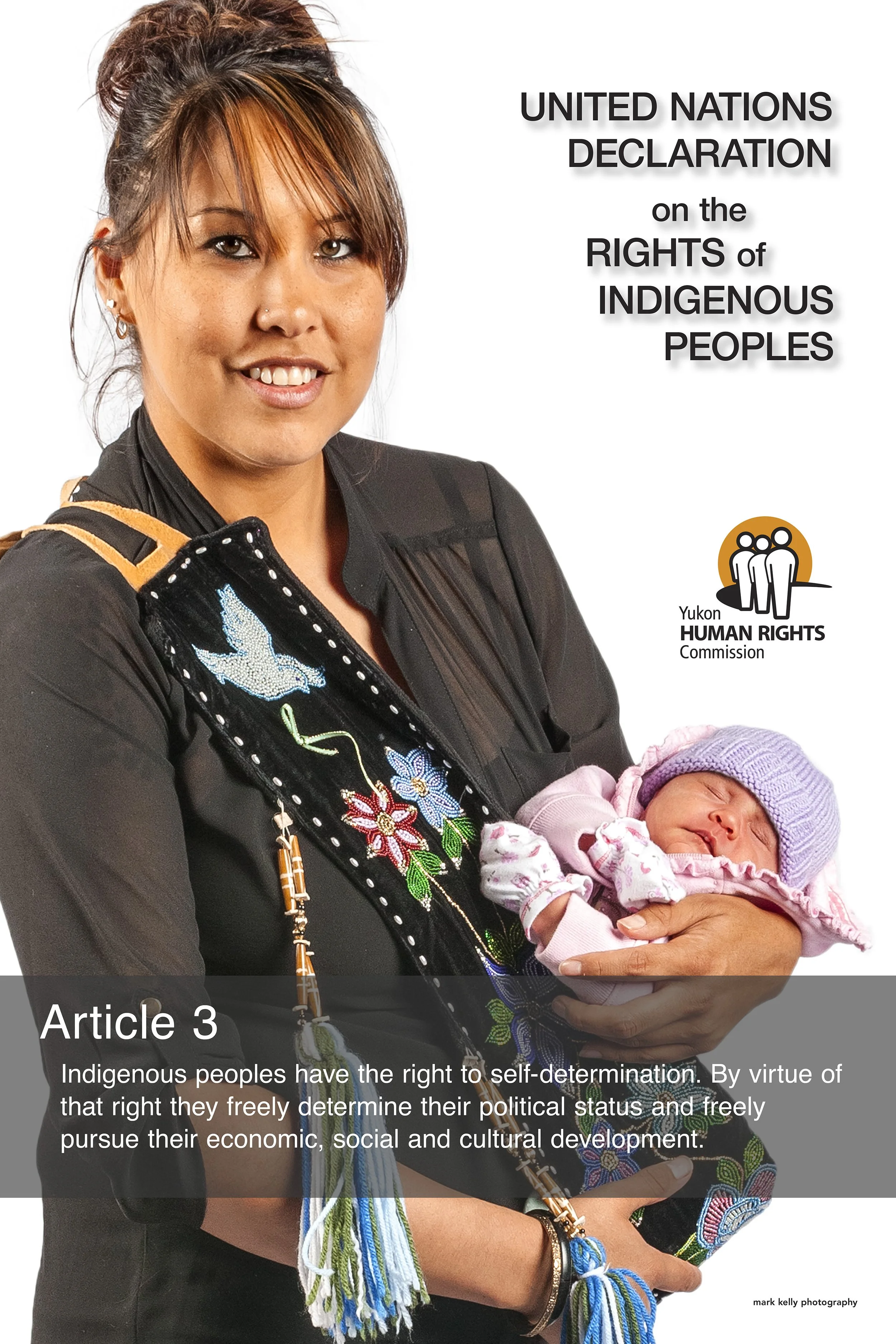 Indigenous woman holding baby, promoting United Nations Declaration on the Rights of Indigenous Peoples.