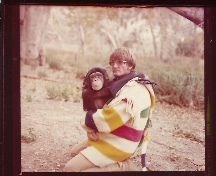 Monty Hugging Baby Chimp.png