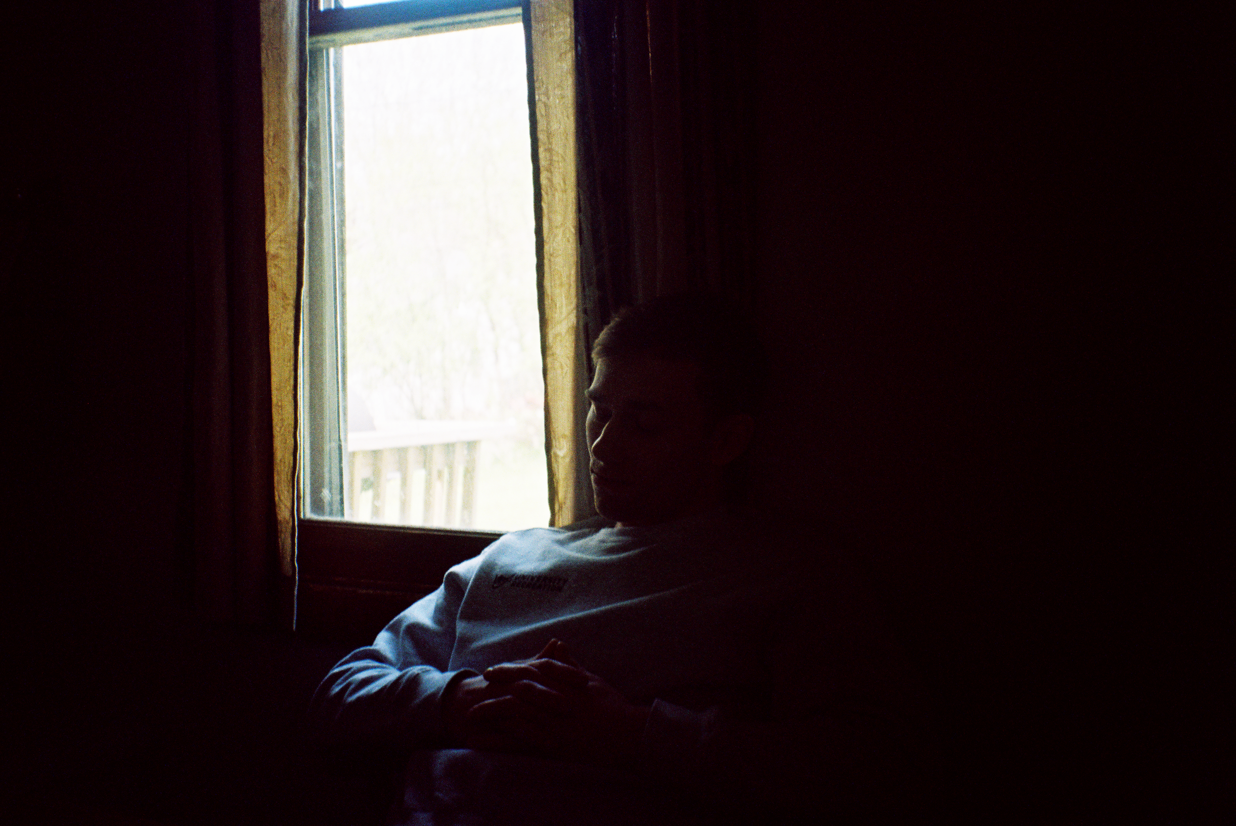 A man sitting by the window