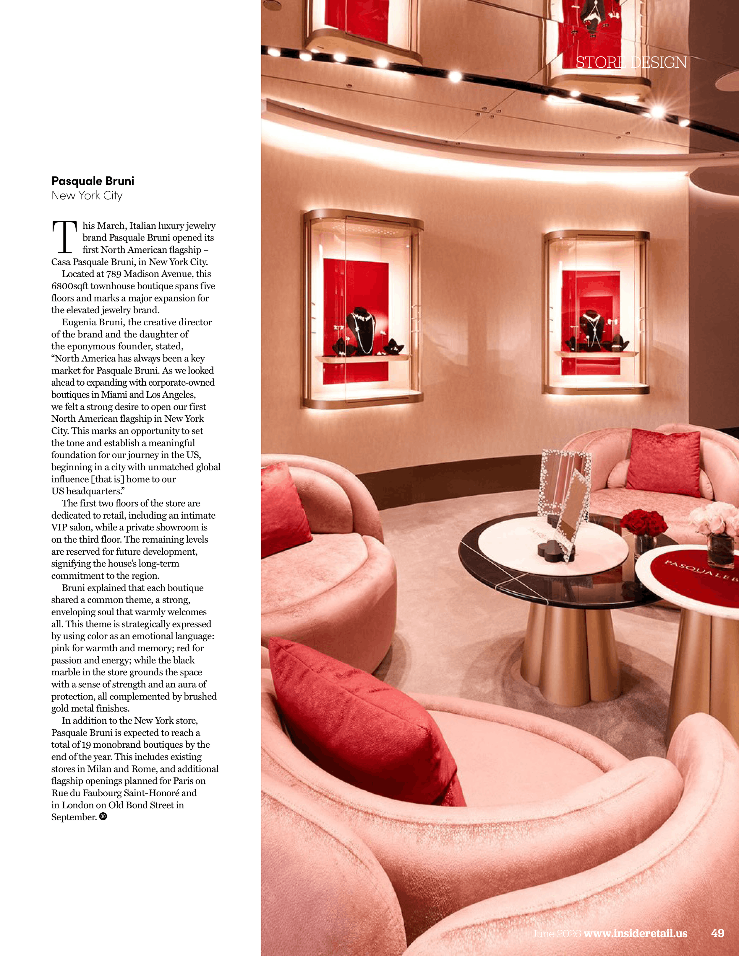 Interior of a store with pink curved velvet seating, a round coffee table with red flowers, and framed jewelry displays with black mannequins in black clothing, illuminated with ceiling lights.