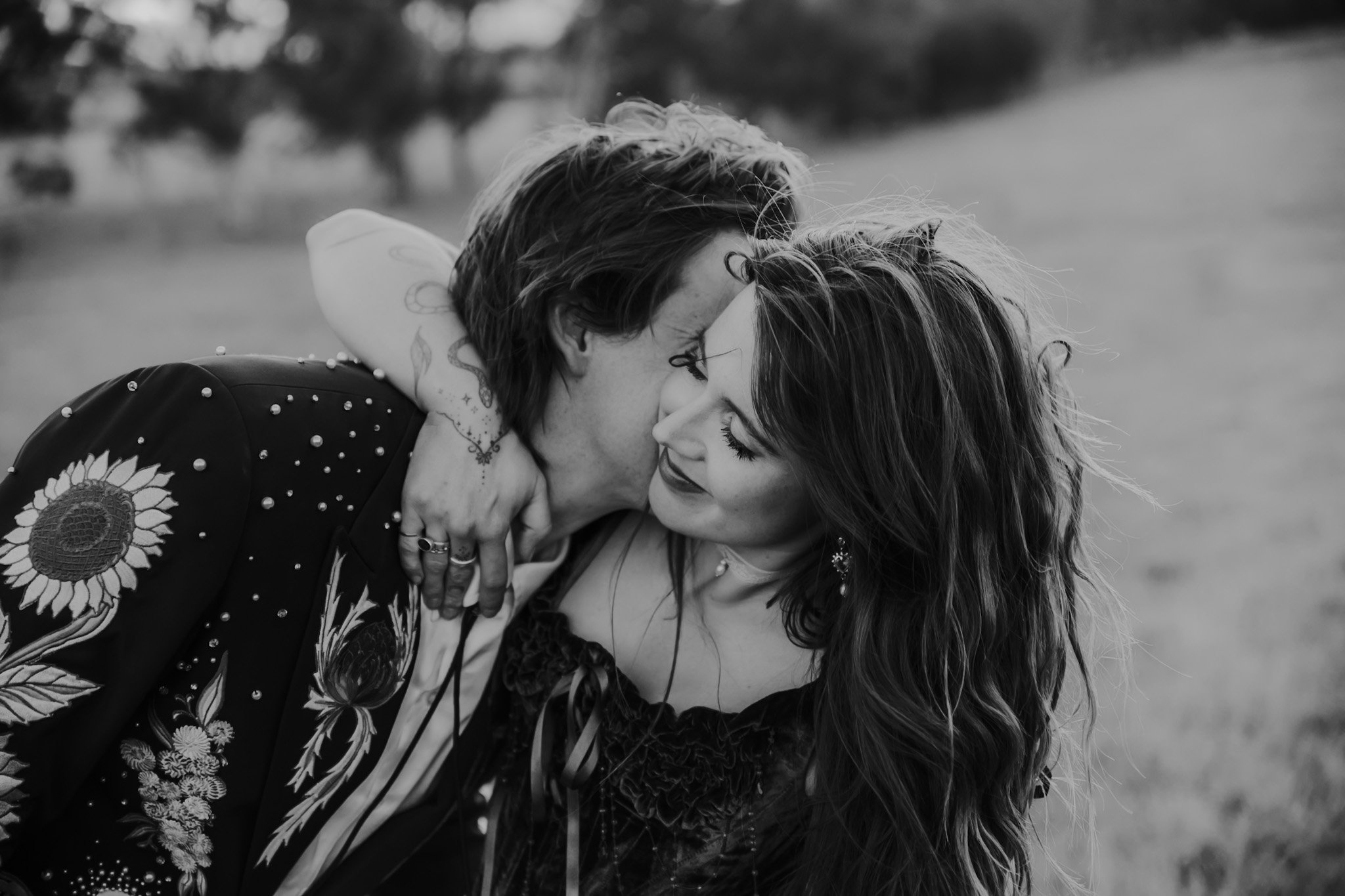 Black and white wedding photo of a couple enjoying a cuddle at their Canberra wedding