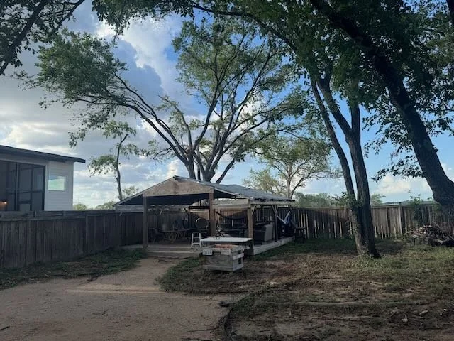 Post-storm clean-up and emergency tree removal on a residential property in Kyle, TX, handled by Dynamo Dusty's expert team.