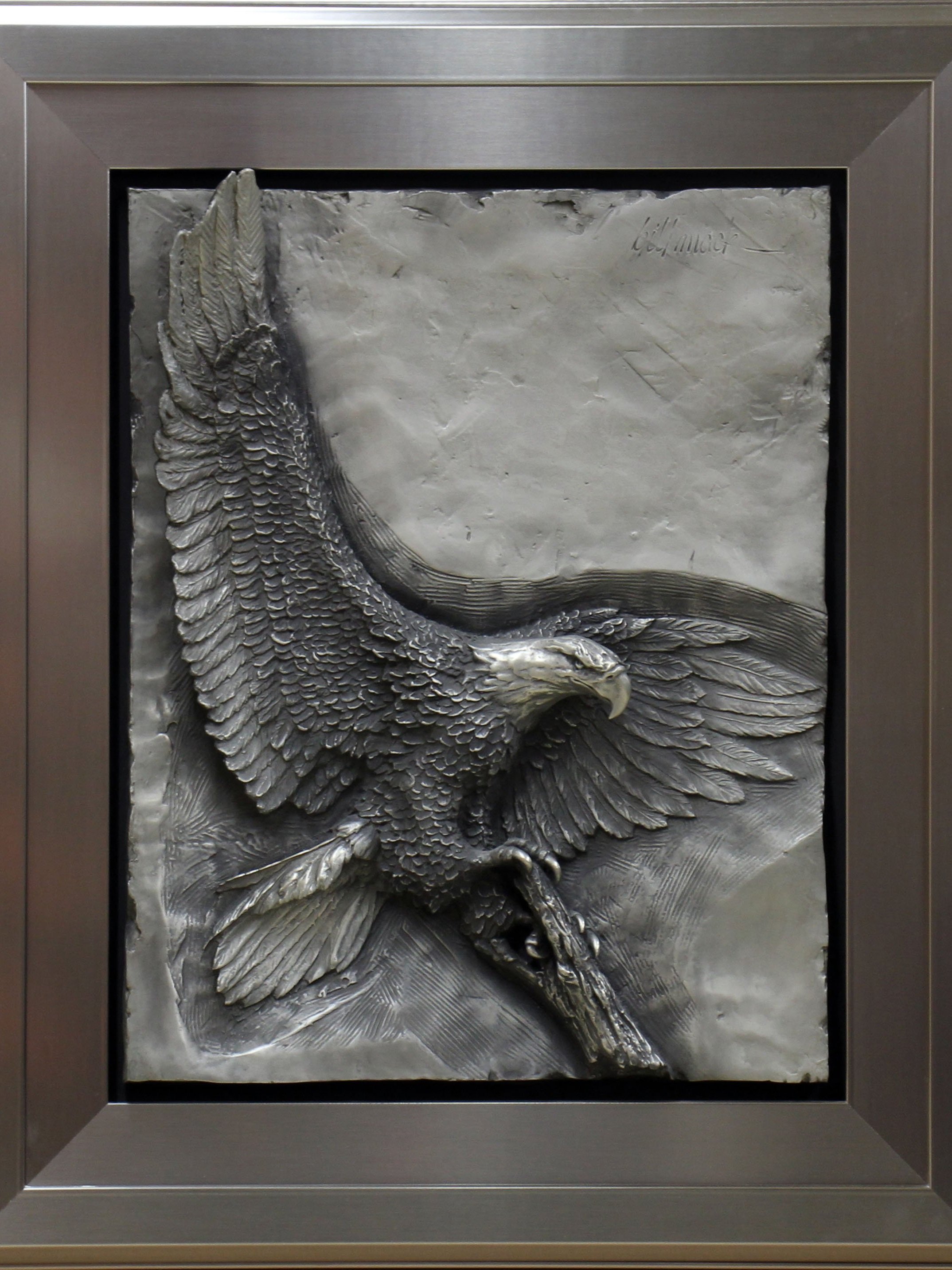Stainless steel relief sculpture of an eagle