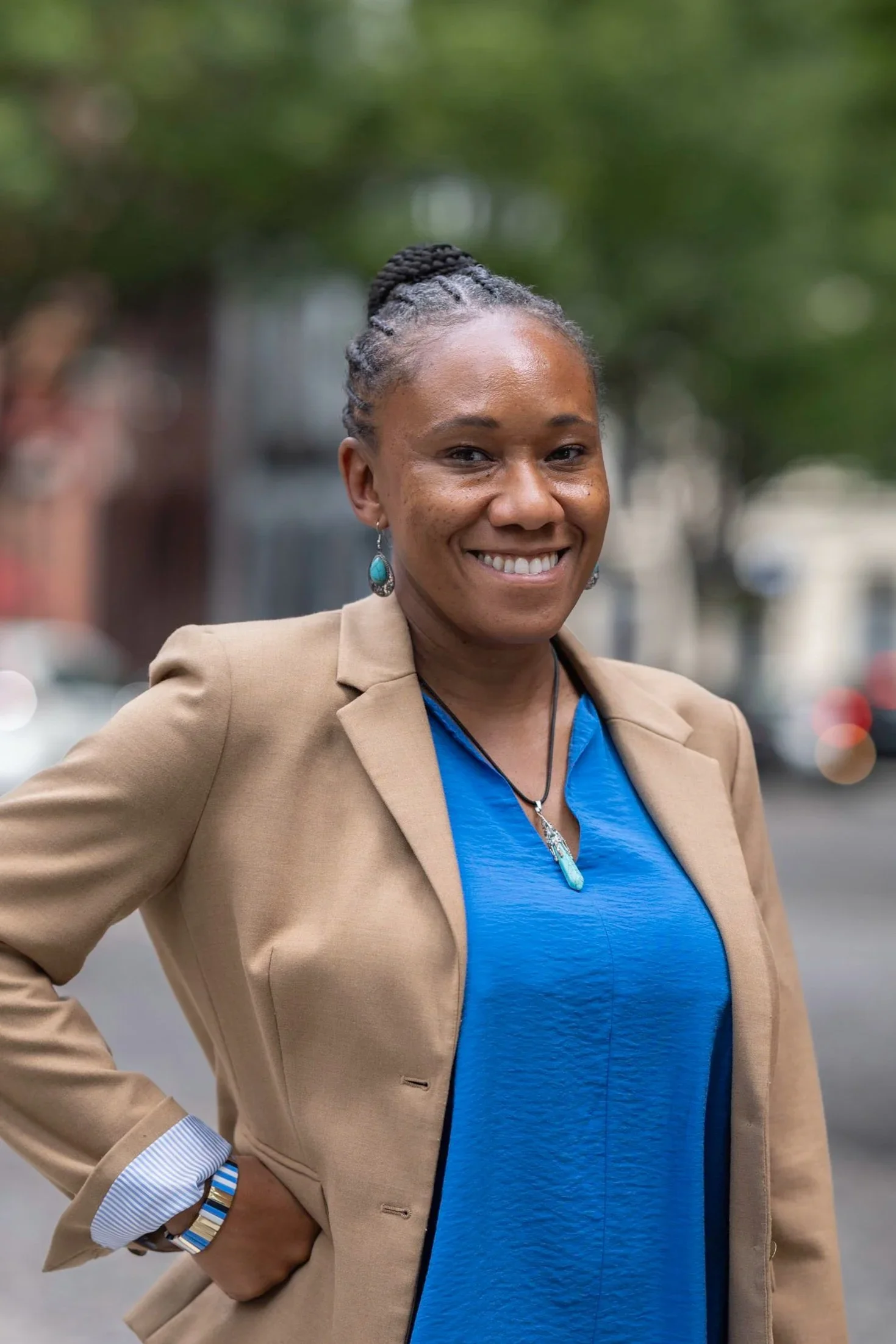 photo of collaborator Chanda Causer wearing a tan jacket and blue blouse