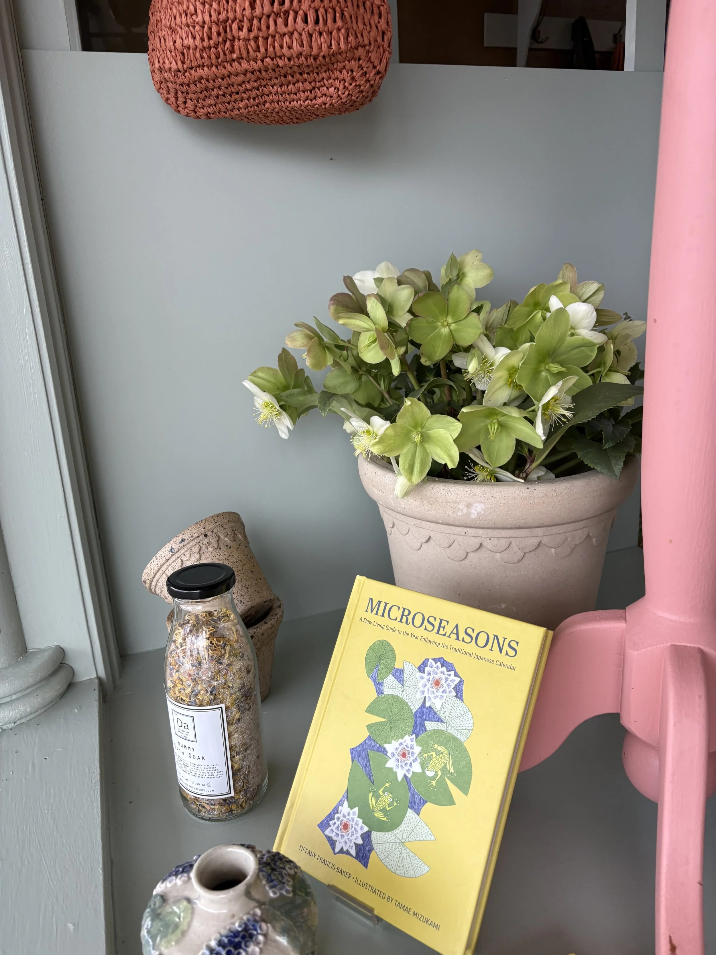 Japanese book and flowers in shop window