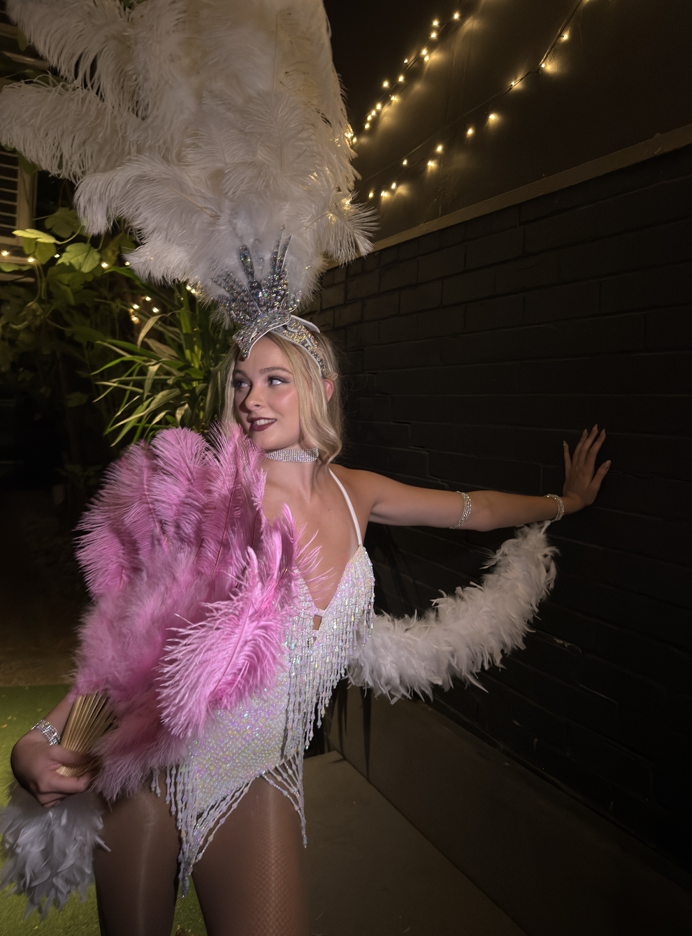 glamorous gatsby dancer with feathered fan at birthday party
