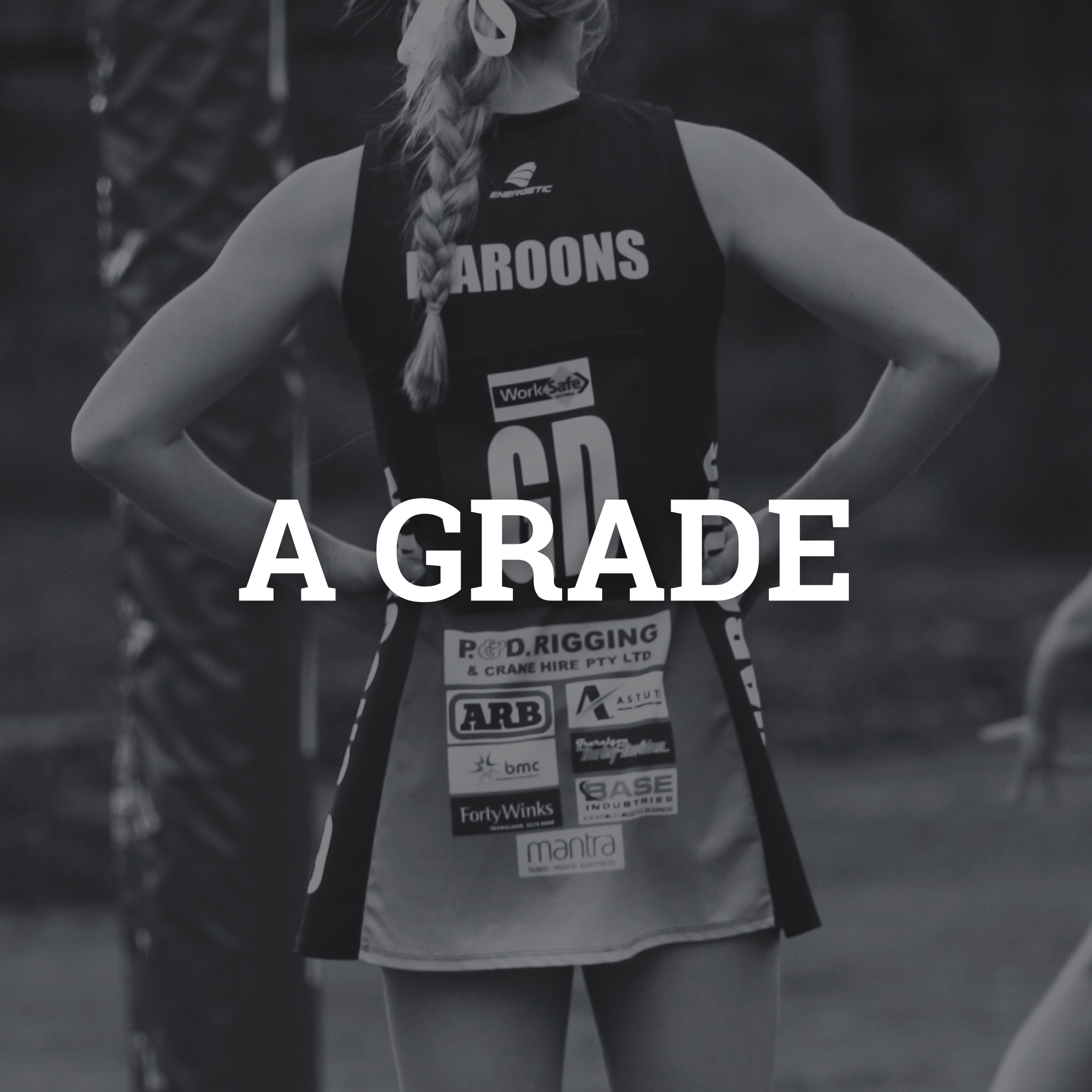 A woman in a sports uniform with her hands on her hips, standing in front of a dark background, with the words "A GRADE" written across the front of the image.