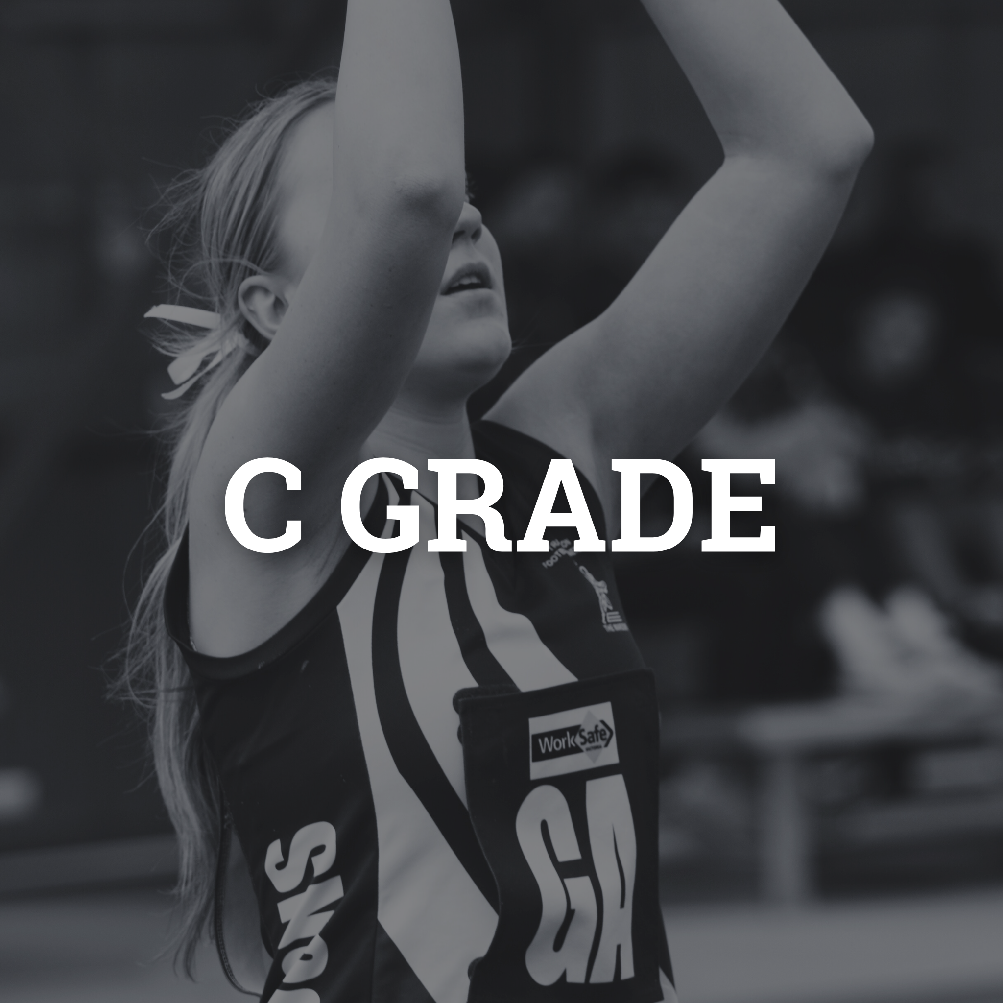 A young female athlete with blonde hair in a ponytail, wearing a sports jersey, is raising her arms in celebration or victory.