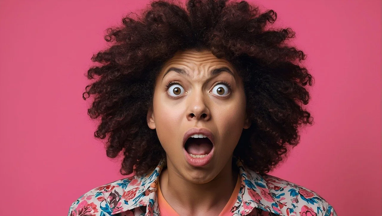 Woman in a panic with her mouth and eyes wide open